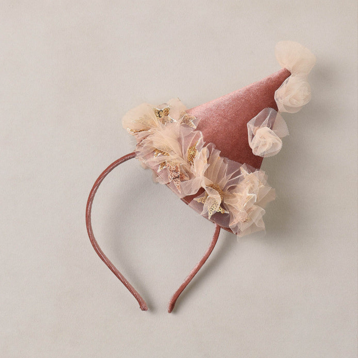 a pink tulle clown hat headband. 