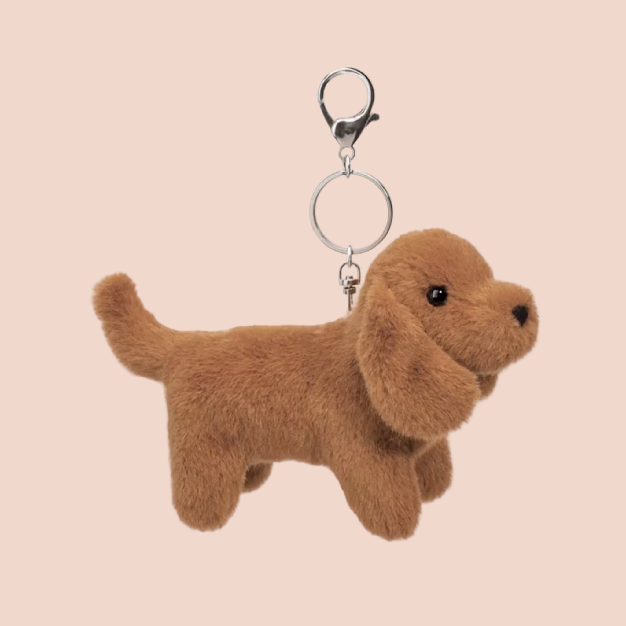 A dachshund shaped bag charm keychain. 