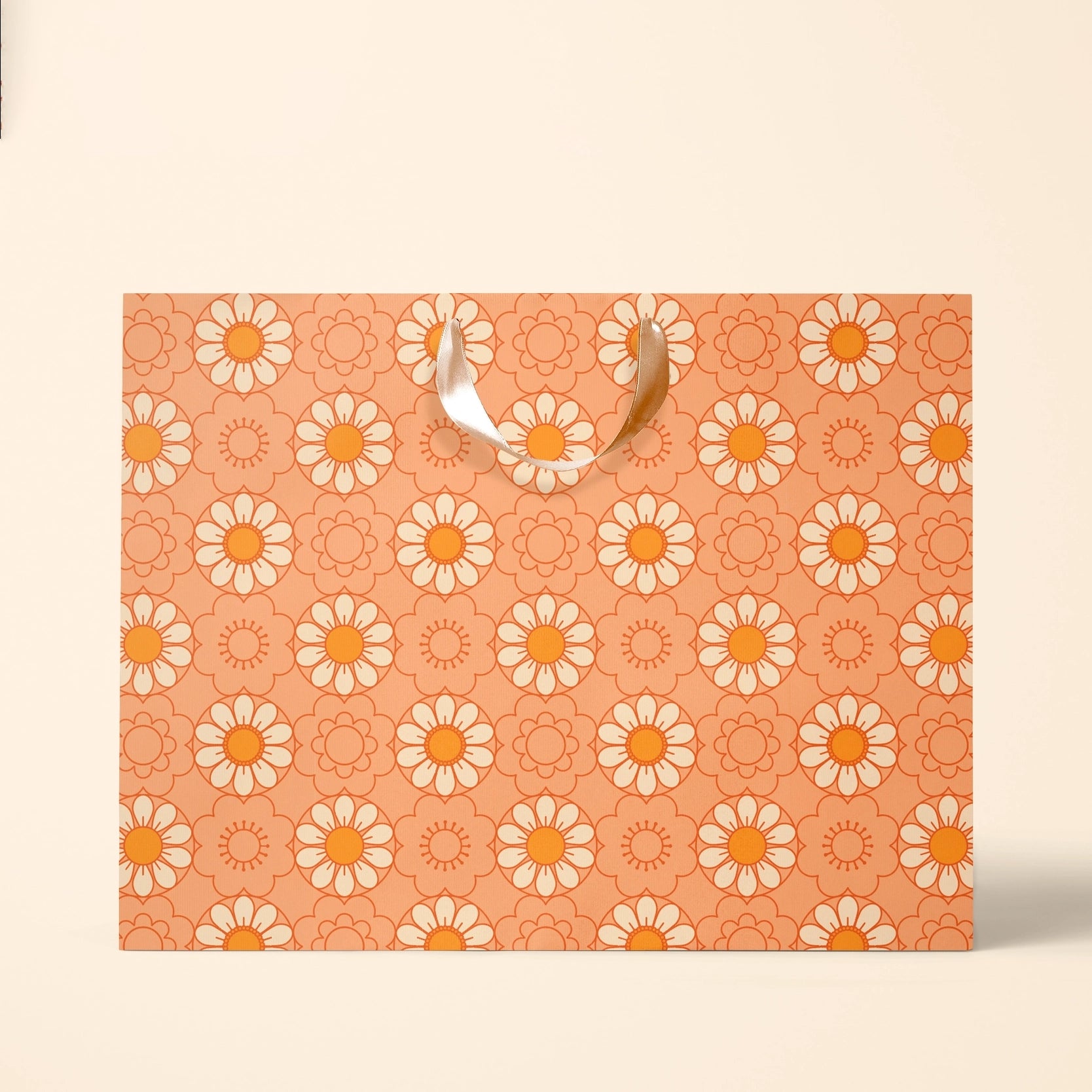 On an ivory background is the large gift bag with an orange color and an ivory and orange daisy pattern.