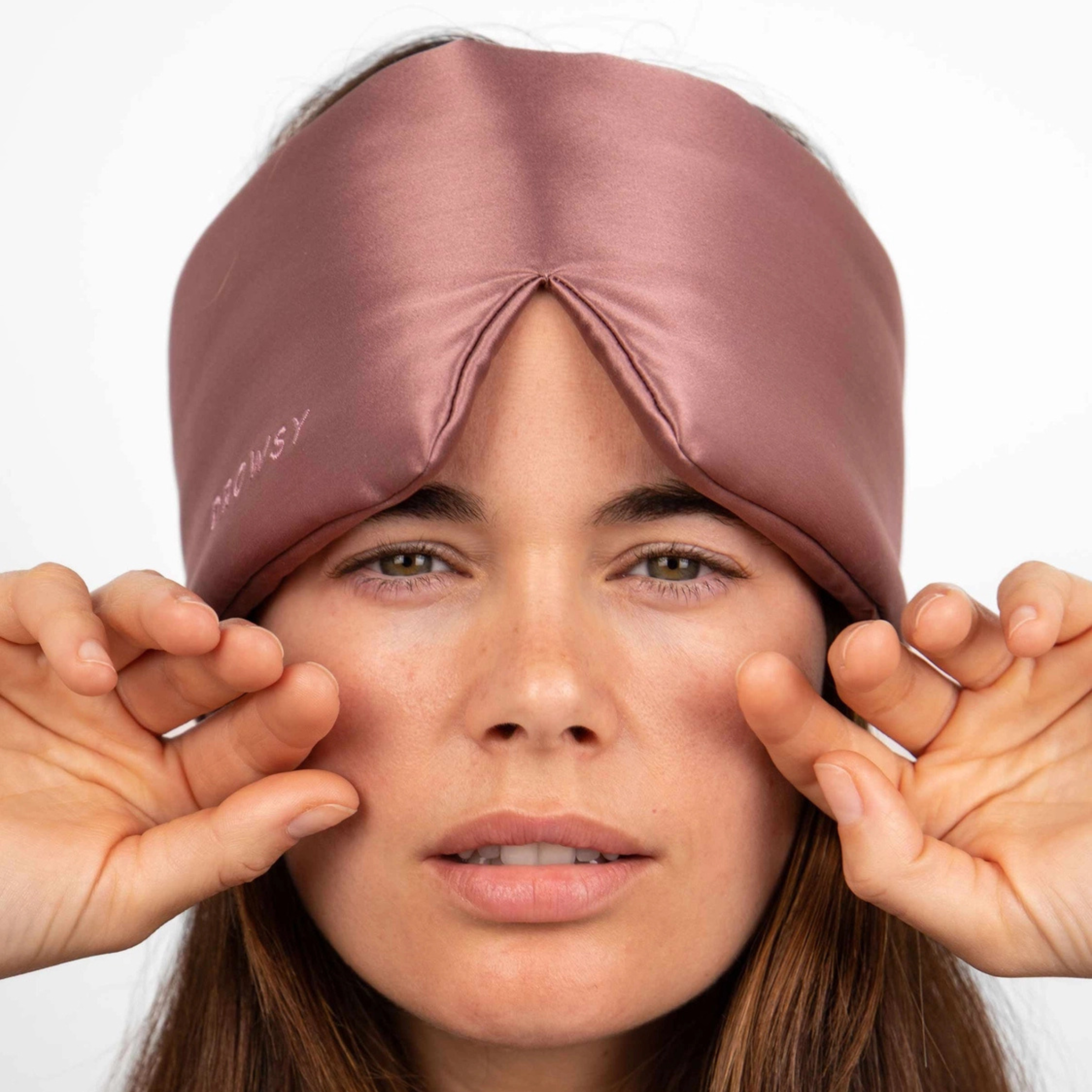 a dusty pink padded eye mask