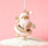 A gold Santa shaped ornament. 