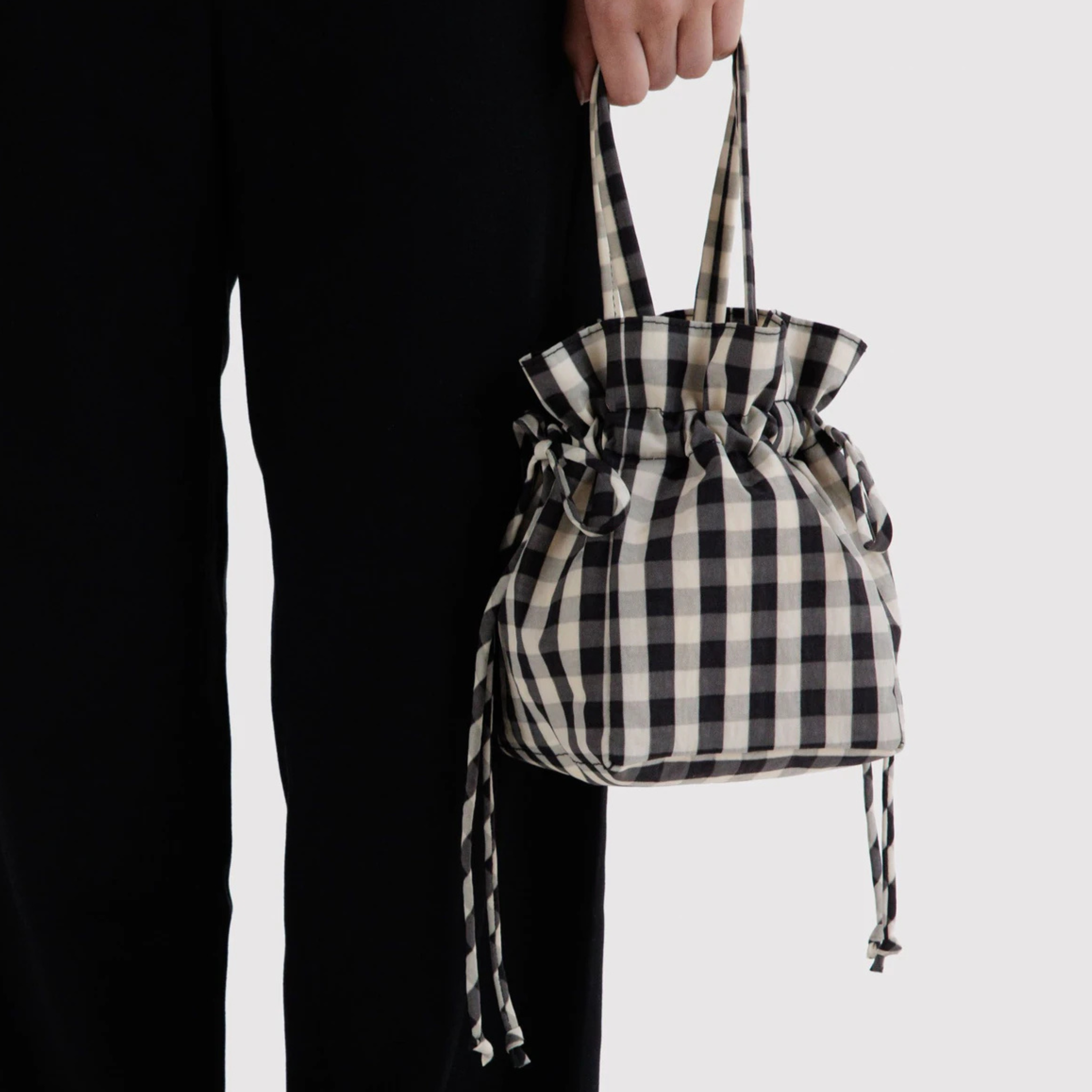 A black and cream drawstring bag.