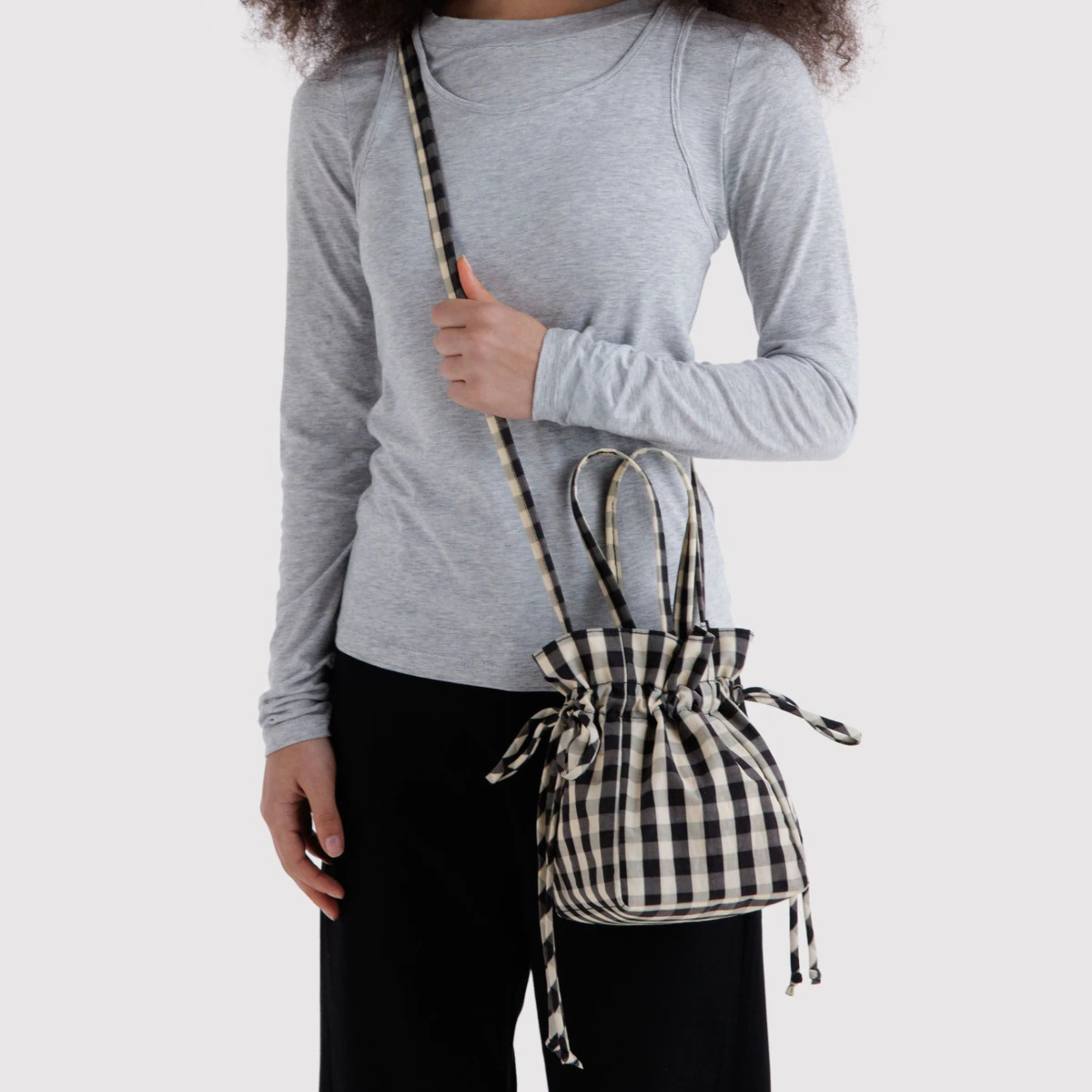 A black and cream drawstring bag.