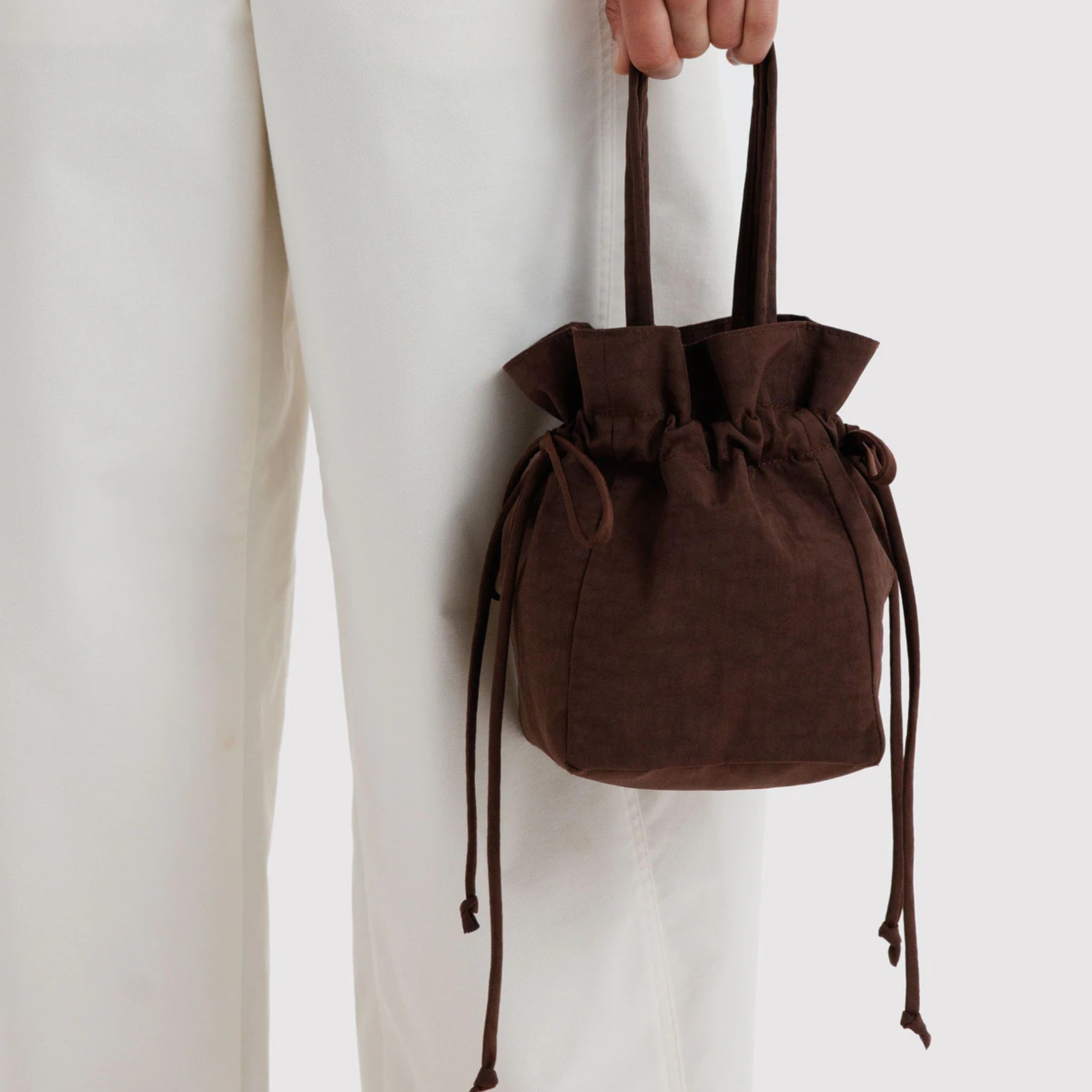 A drawstring brown bucket bag.