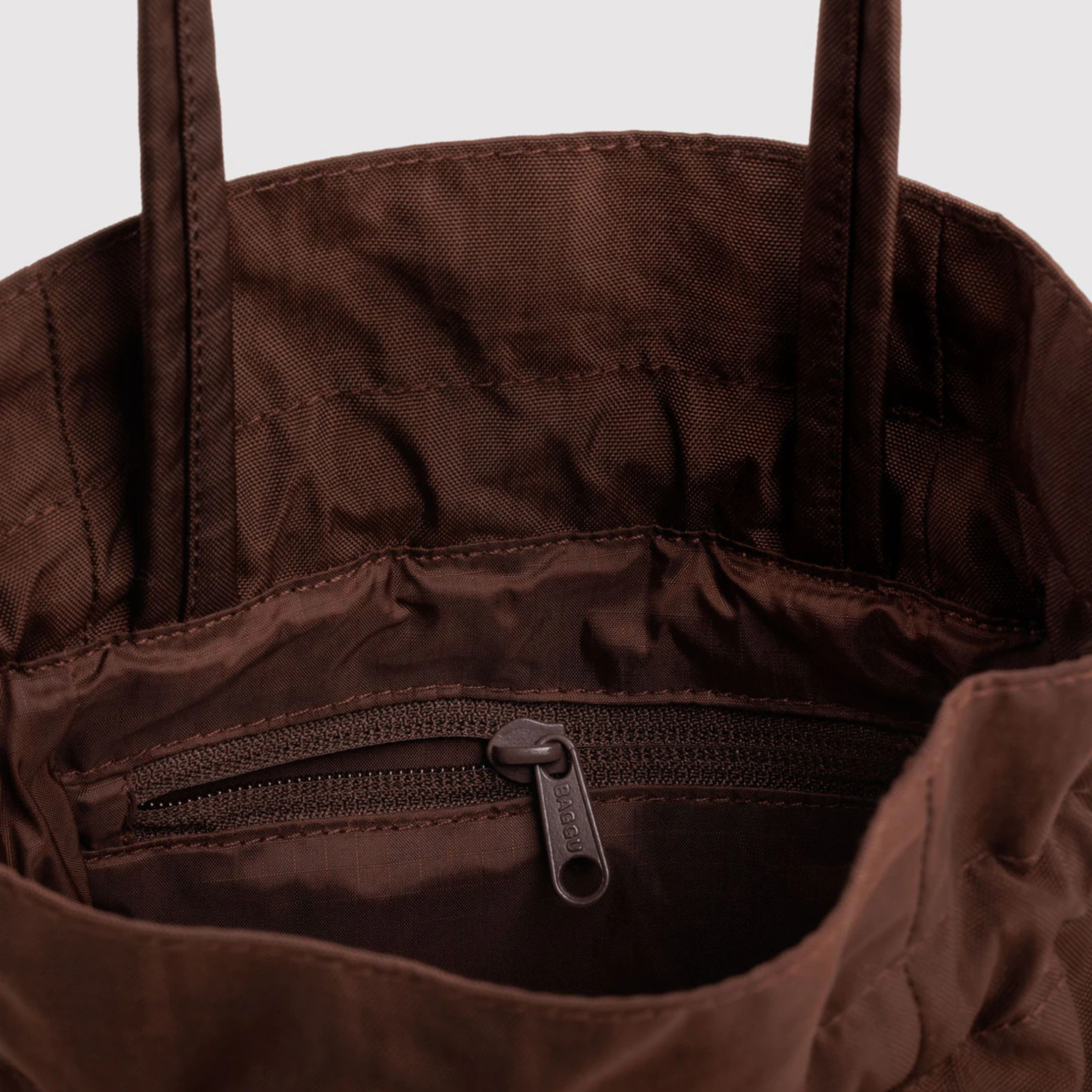 A drawstring brown bucket bag.