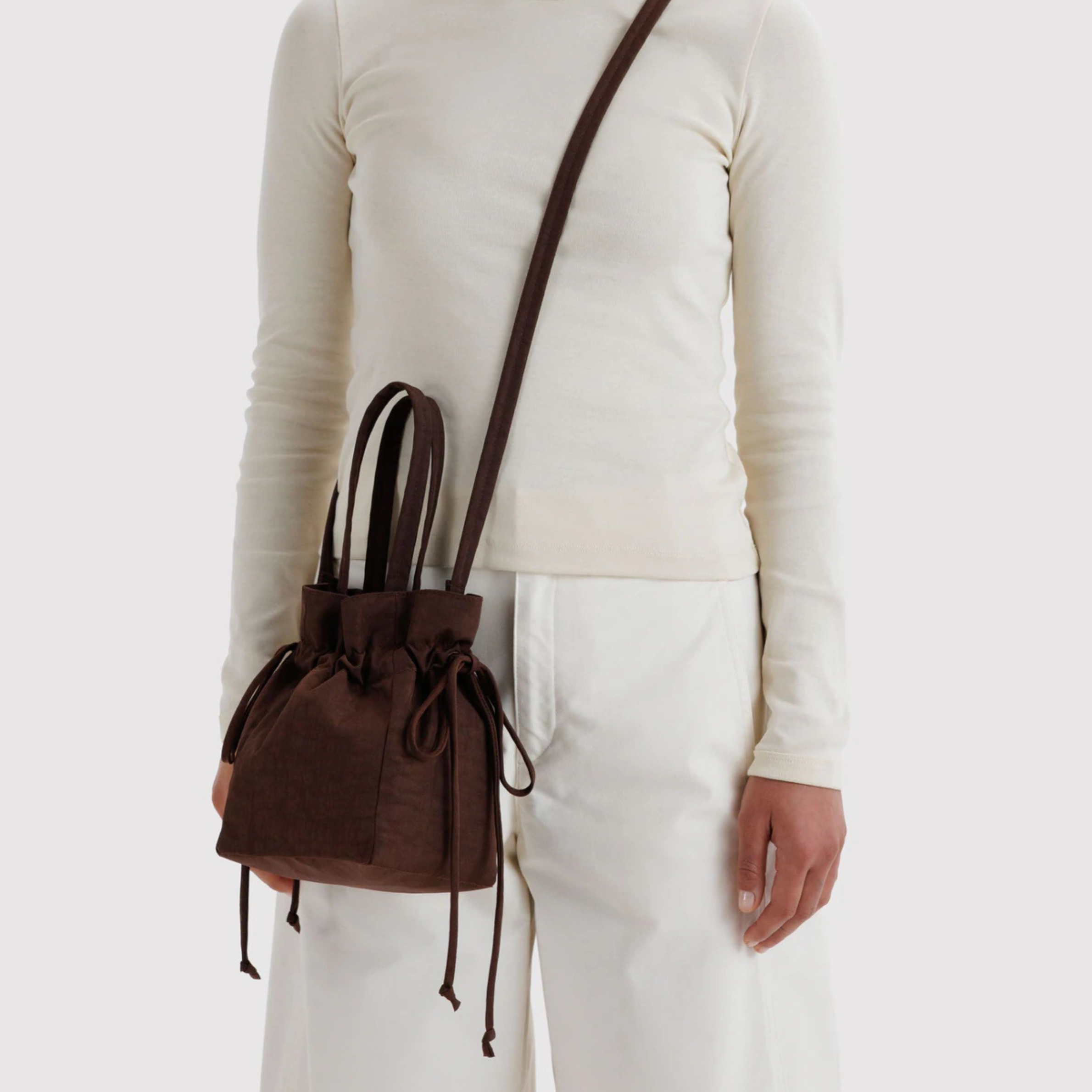 A drawstring brown bucket bag.