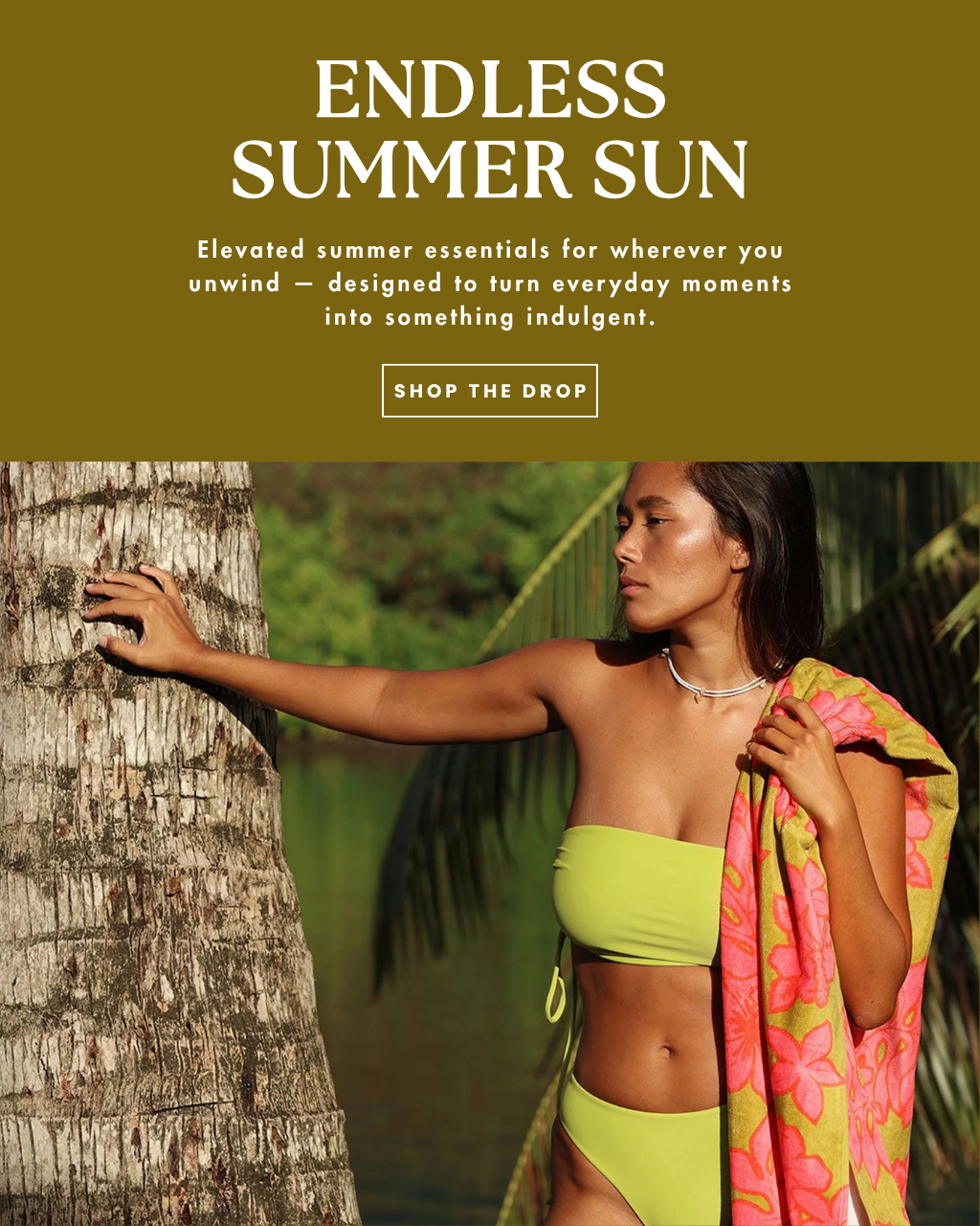 A website banner of a woman in a lime green bathing suit standing with a towel over her shoulder and palm trees in the distance.  The text on that banner reads, "endless summer sun- elevated summer essentials for wherever you unwind- designed to turn everyday moments into something indulgent."