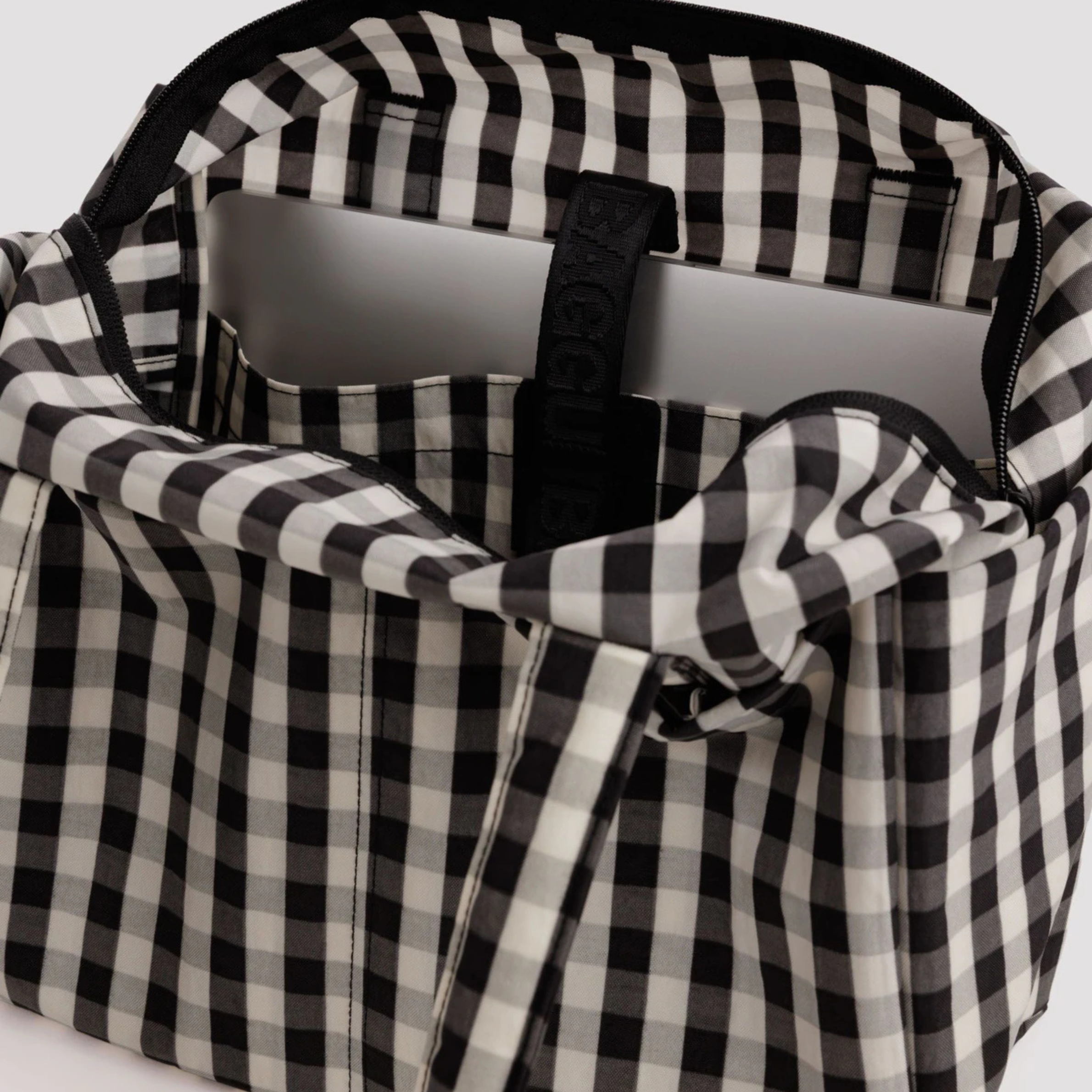 A black and cream gingham everyday cloud bag.