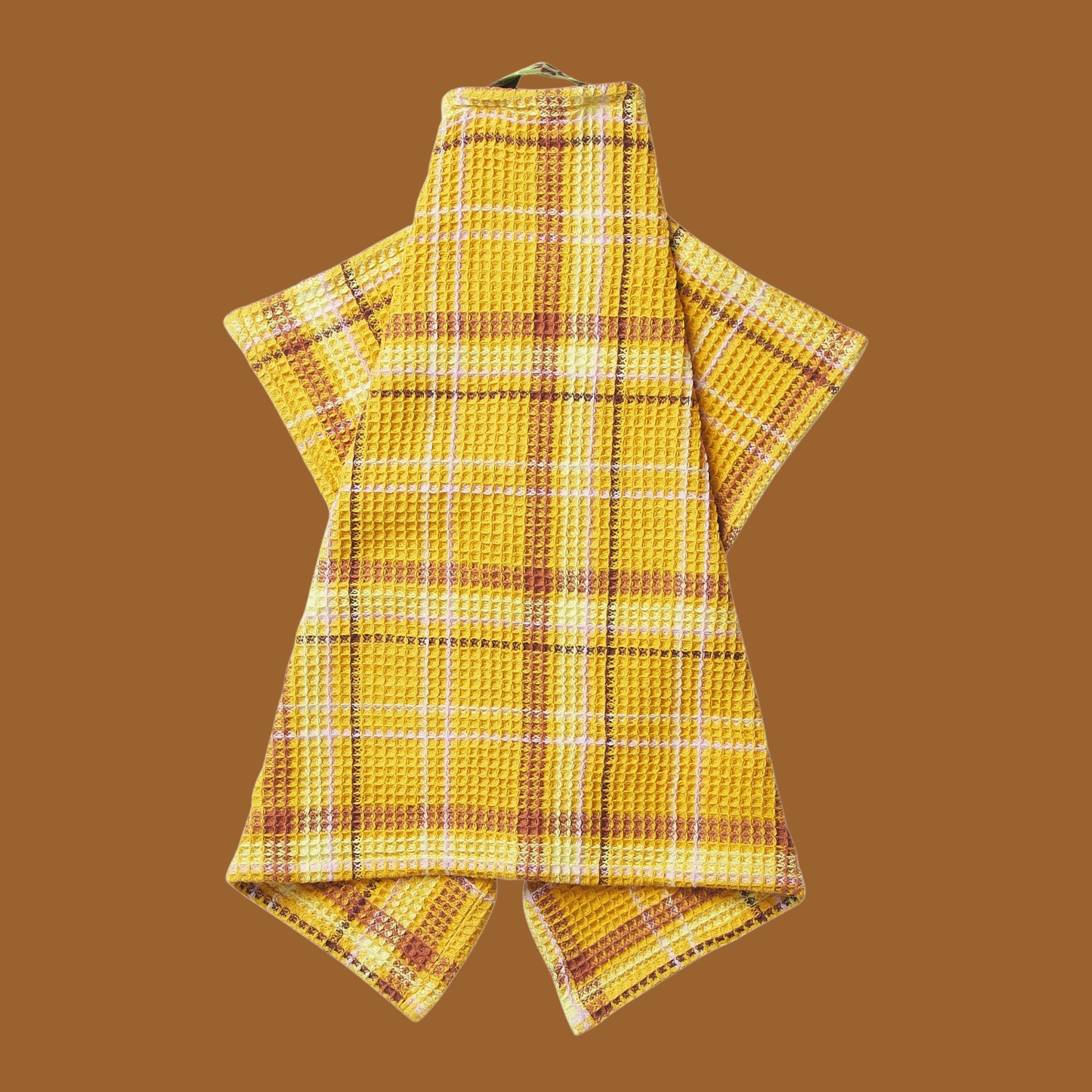a yellow waffle knit towel. 