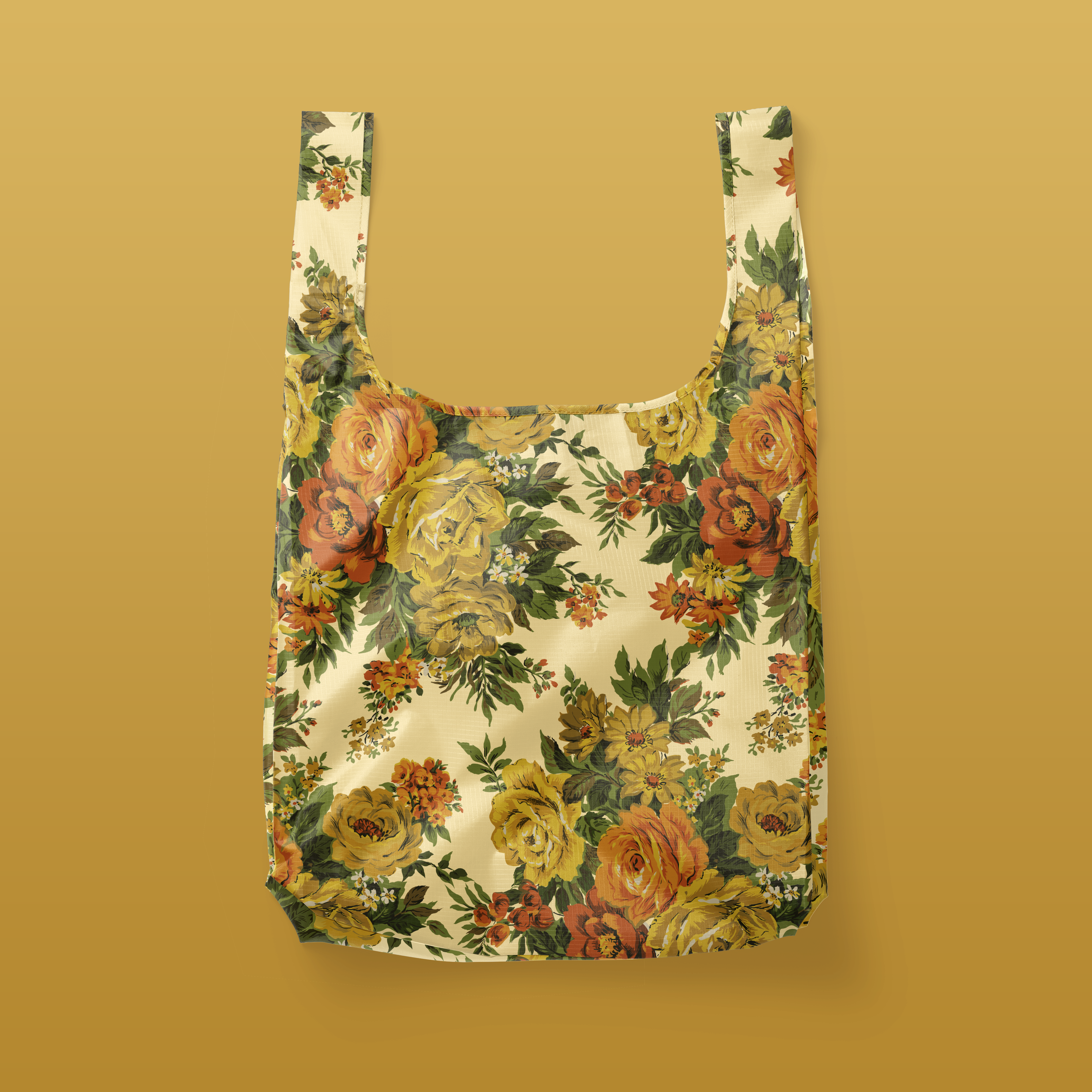 A floral yellow and orange nylon reusable bag. 
