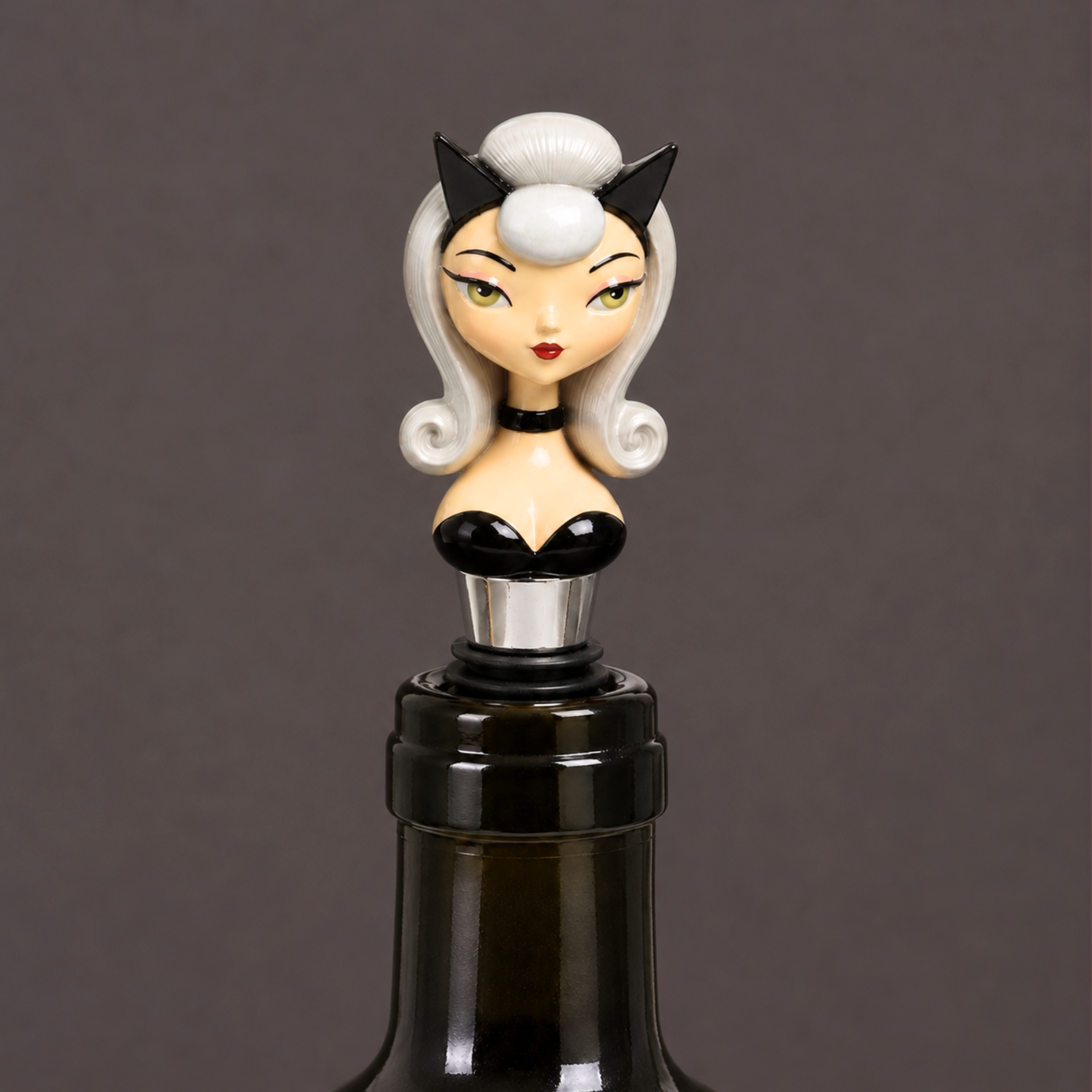 a bottle stopper in the shape of a pin up girl with a cat costume on.