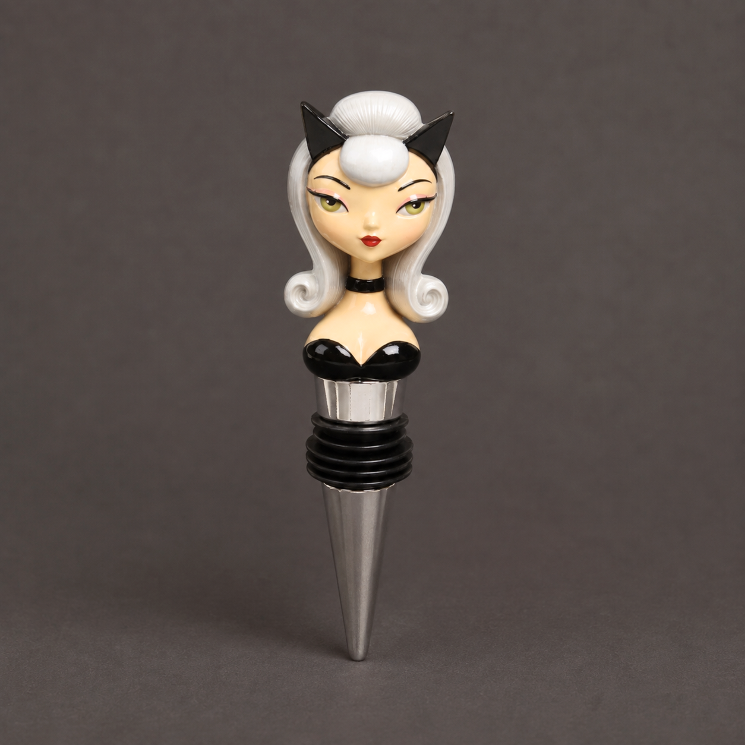 a bottle stopper in the shape of a pin up girl with a cat costume on.