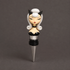 a bottle stopper in the shape of a pin up girl with a cat costume on.