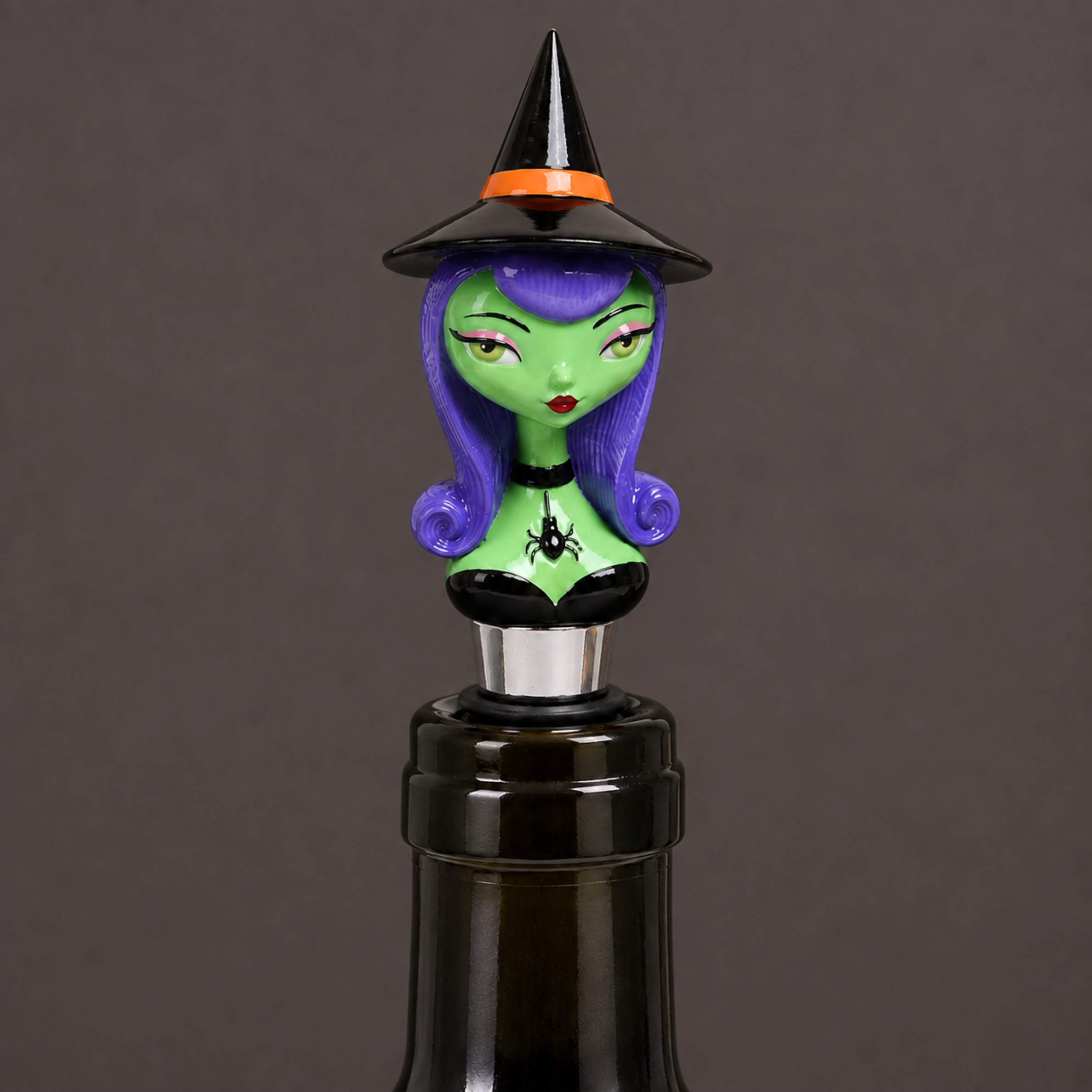 a witch shaped bottle stopper