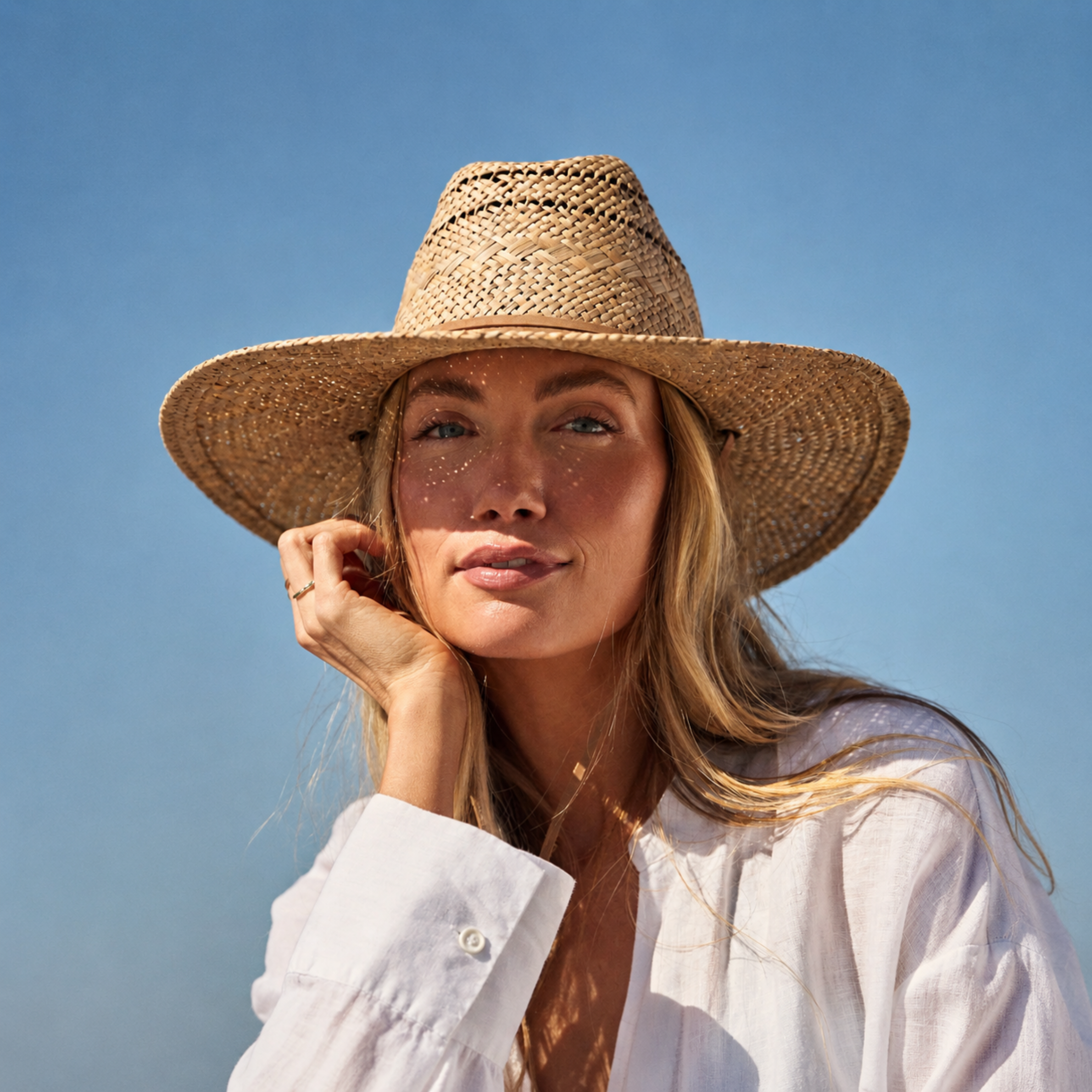 a straw sun hat on a model