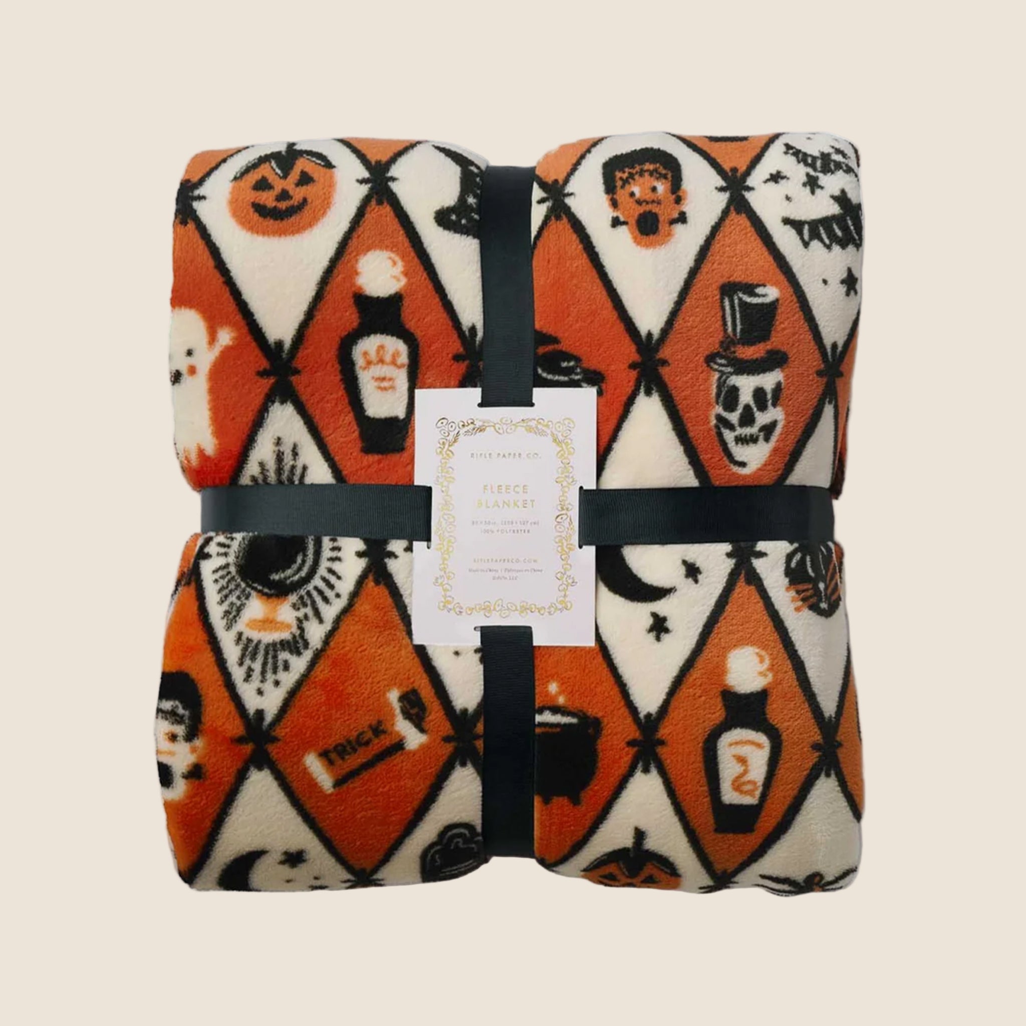 An orange, ivory and black diamond pattern fleece blanket with Halloween themed graphics. 
