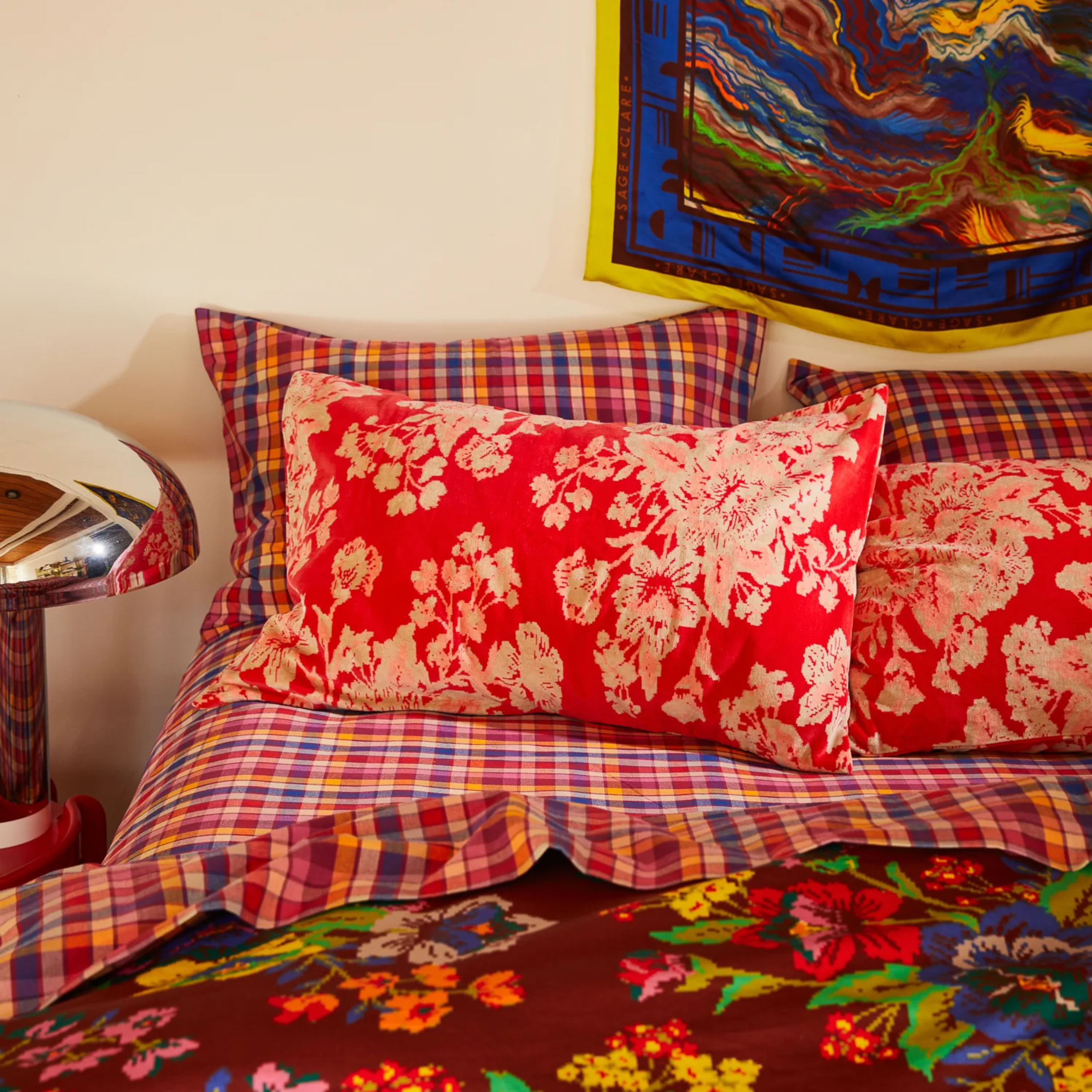 A cream and pink floral pillow