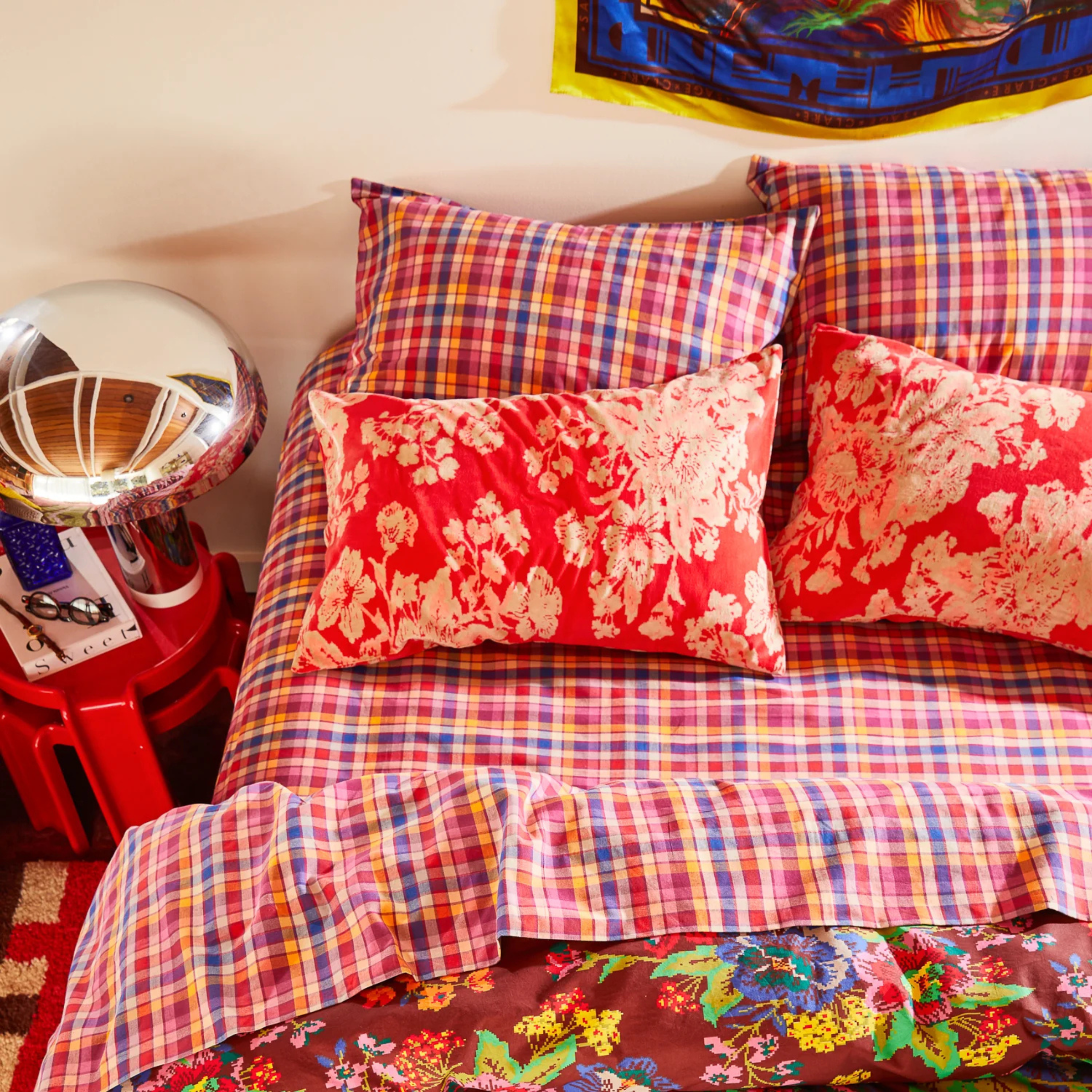 A cream and pink floral pillow