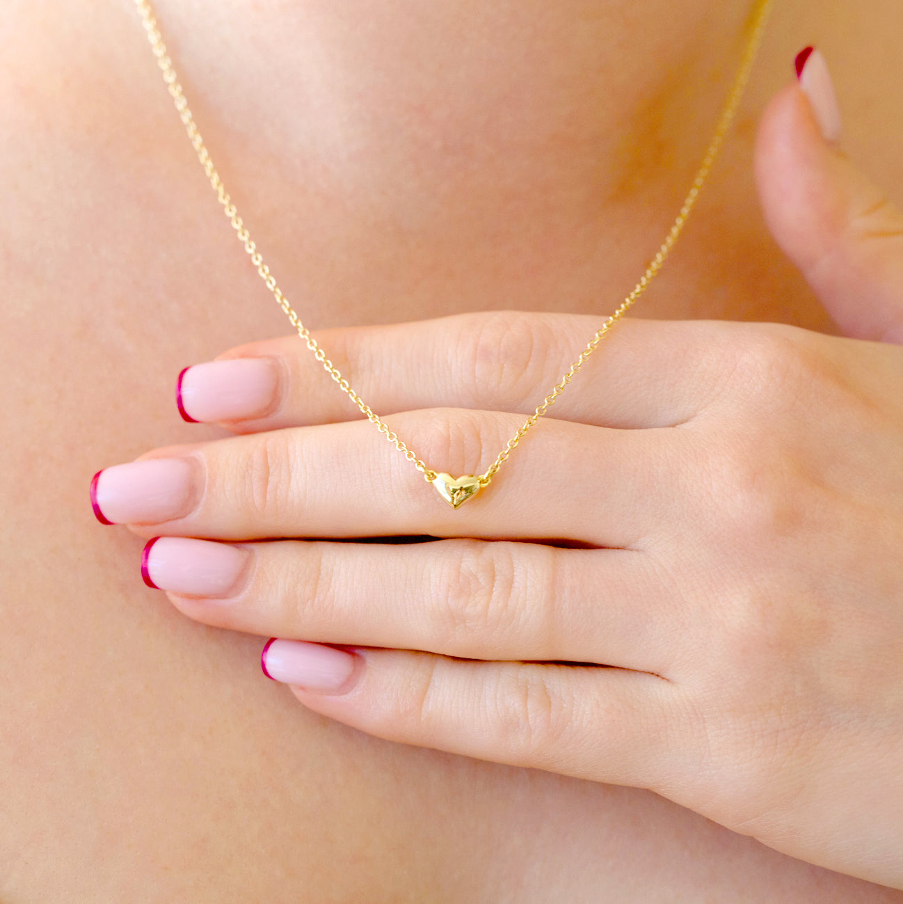 A bubble heart pendant necklace. 