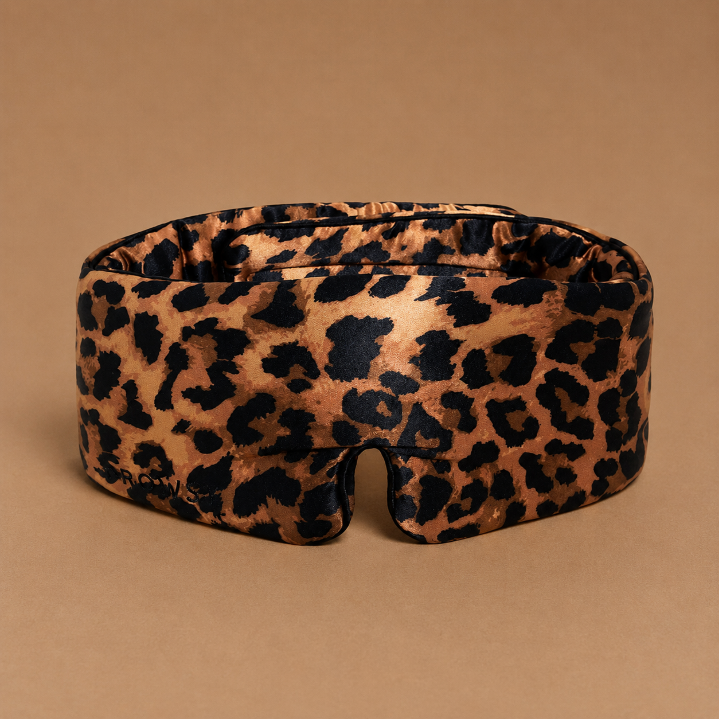 a leopard print padded sleep eye mask.