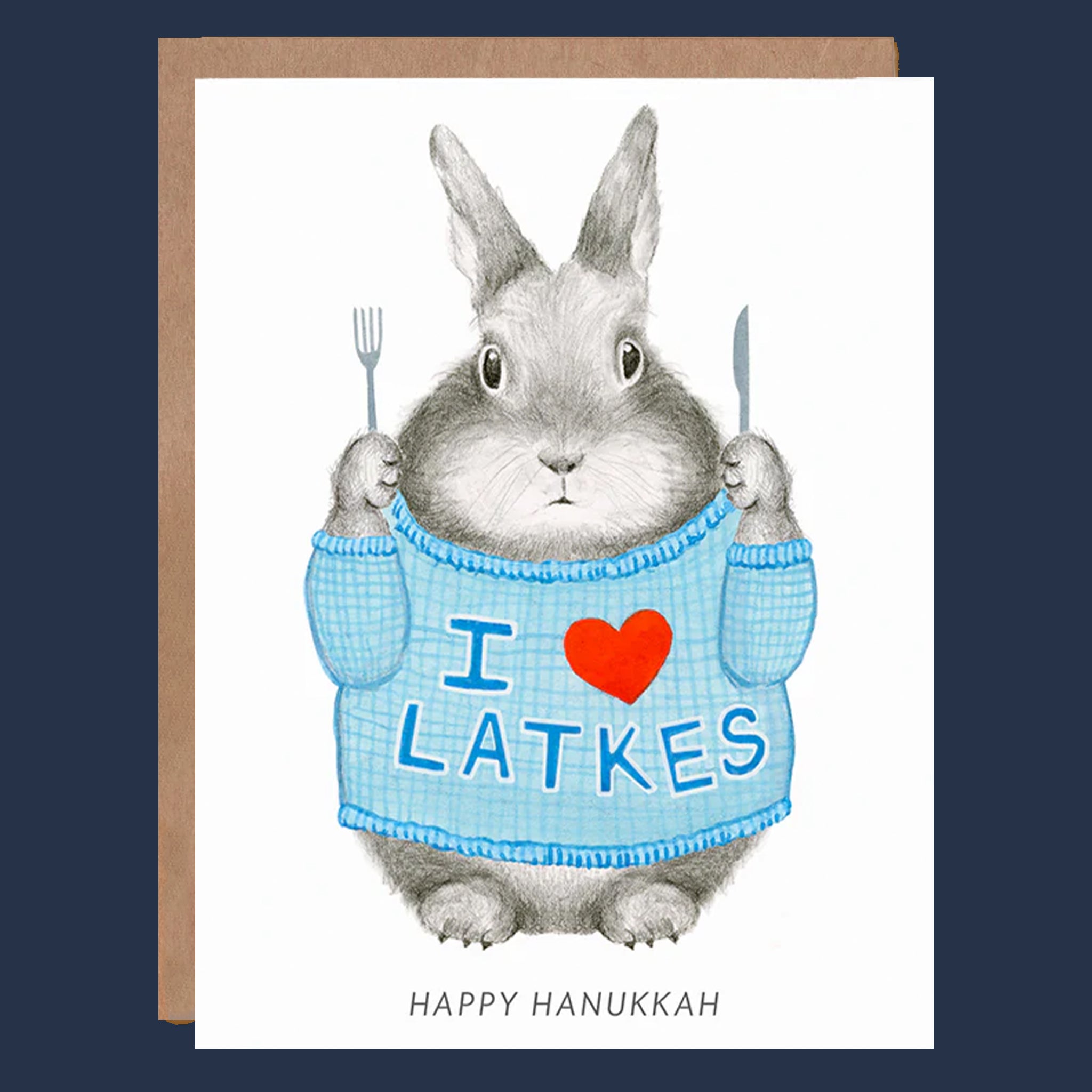 A white card with a graphic of a bunny wearing a sweater that reads, 'I Heart Latkes Happy Hanukkah'. 