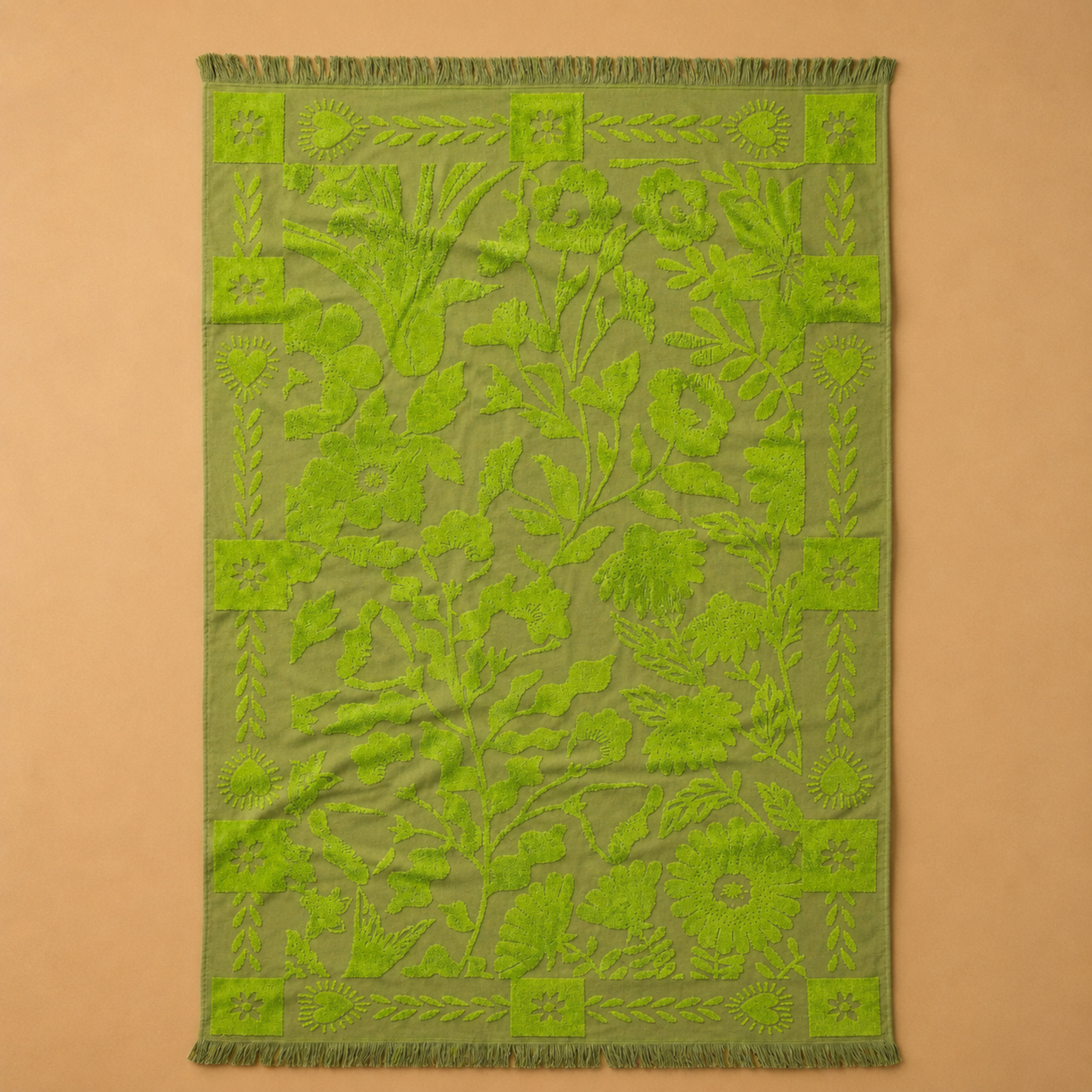 a green floral print reversible bath towel.