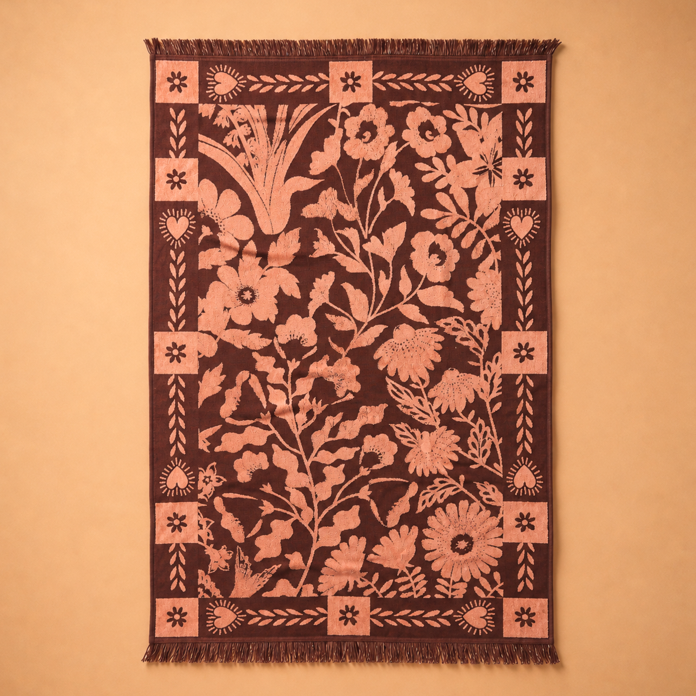 a burgundy and pink floral print bath towel.