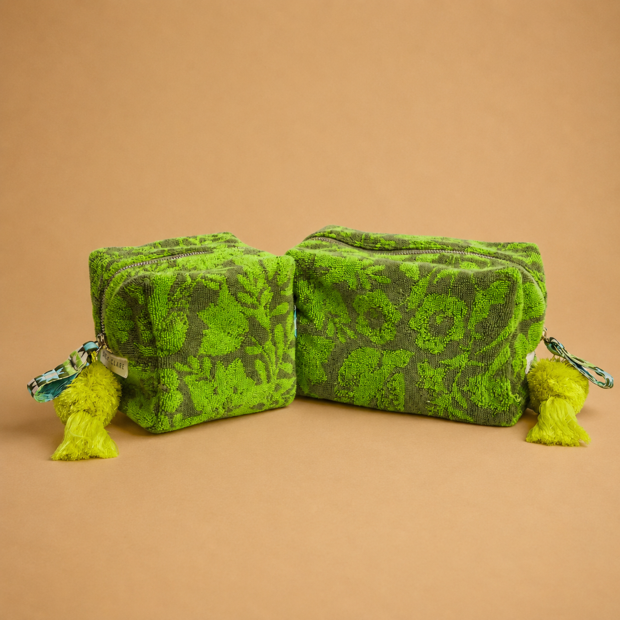 a green floral print terry cloth material pouch. 