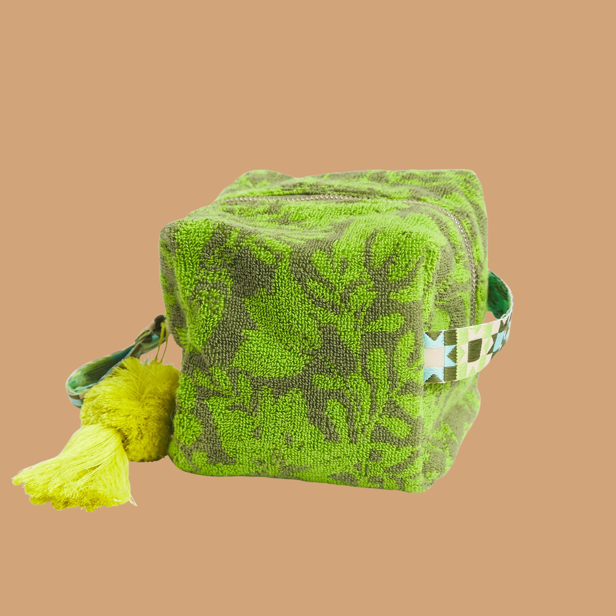 a green floral print terry cloth material pouch. 