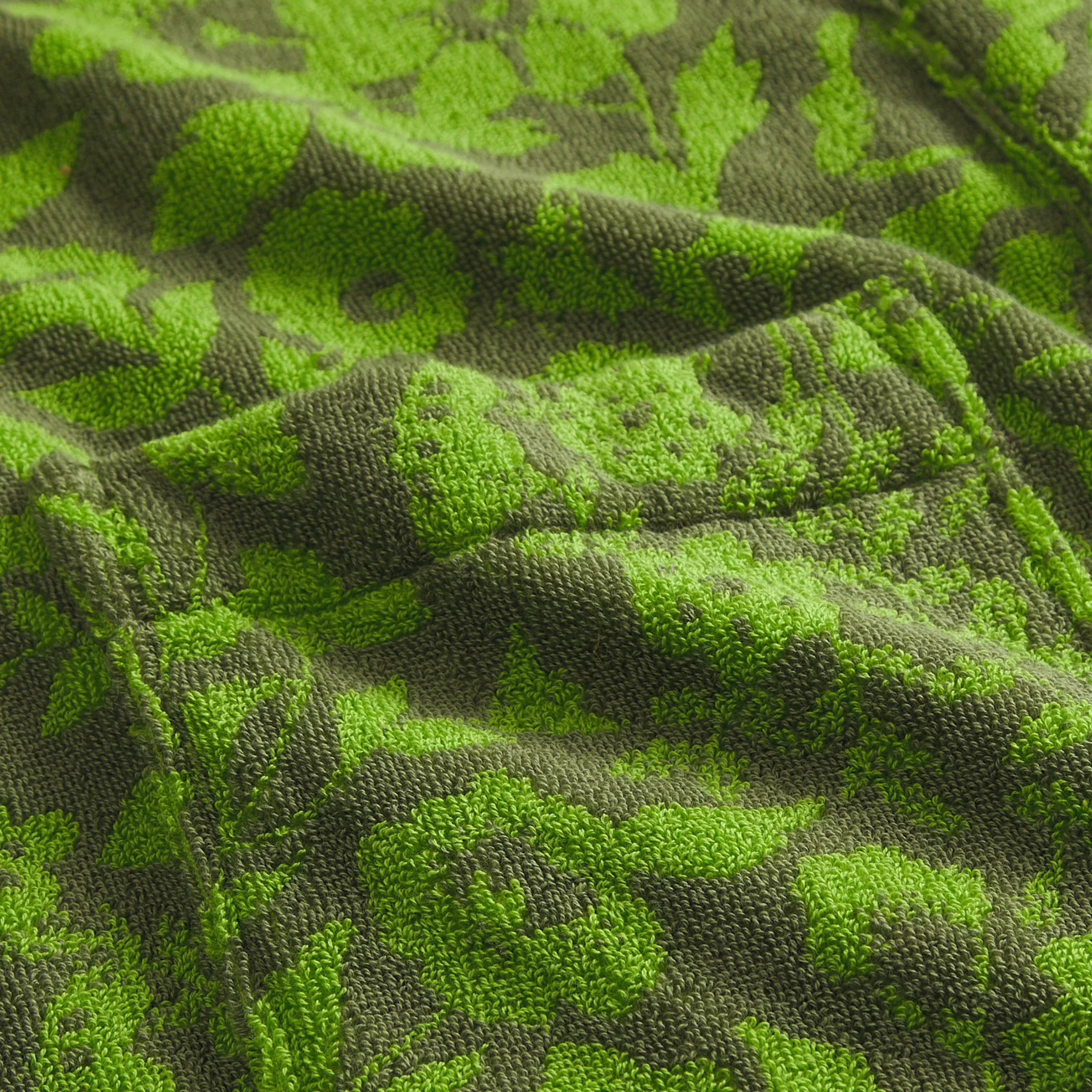 a green floral print bathrobe