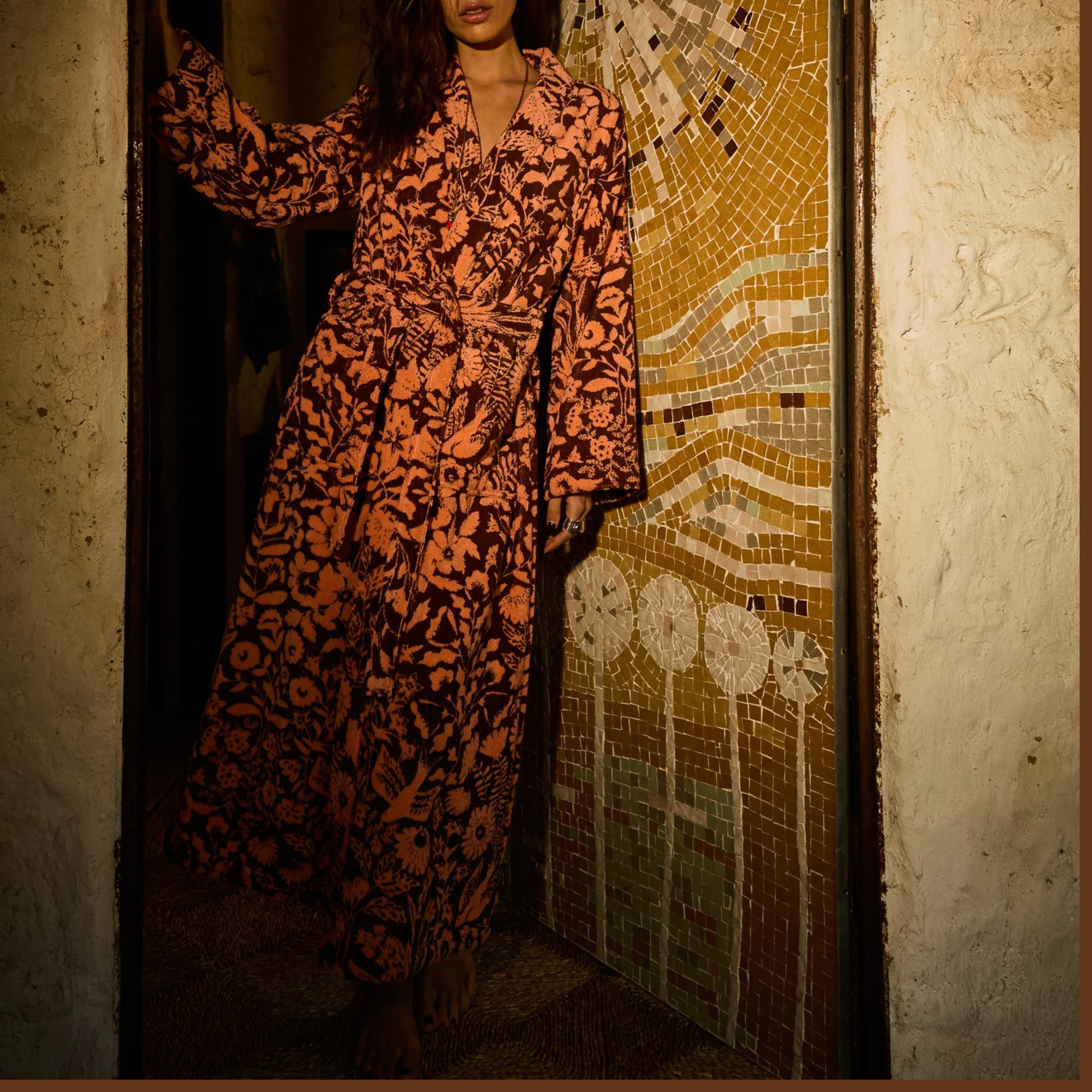 a burgundy and pink floral print bathrobe 