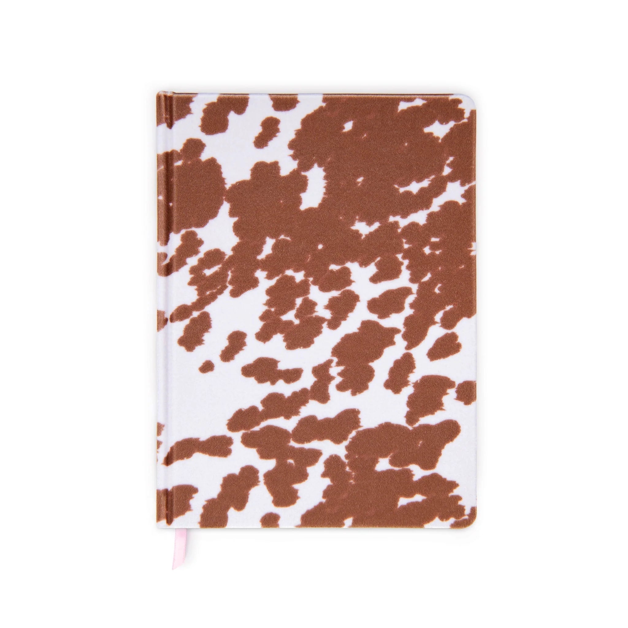 On a white background is a white and brown cow printed journal. 