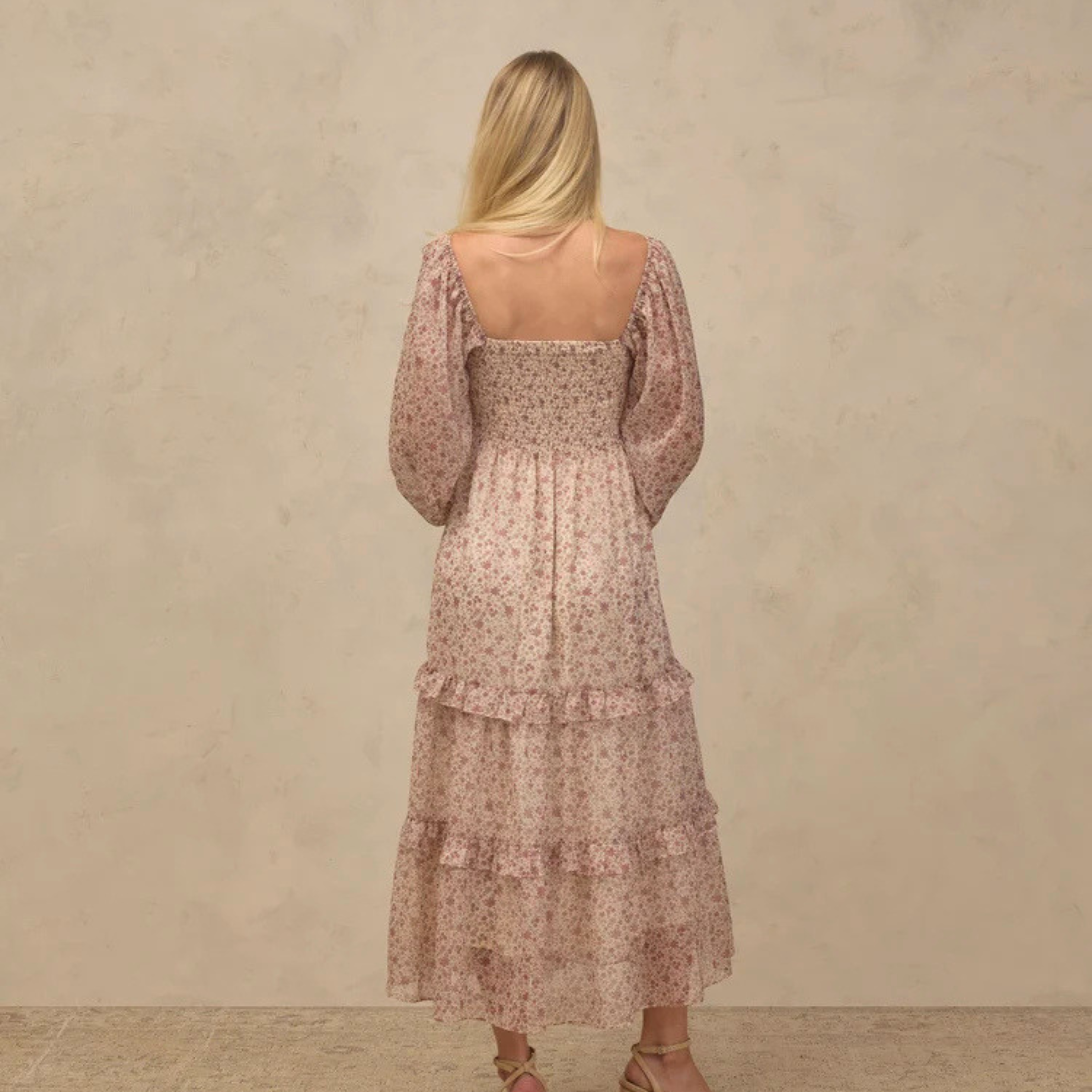 a neutral colored long sleeve maxi dress. 