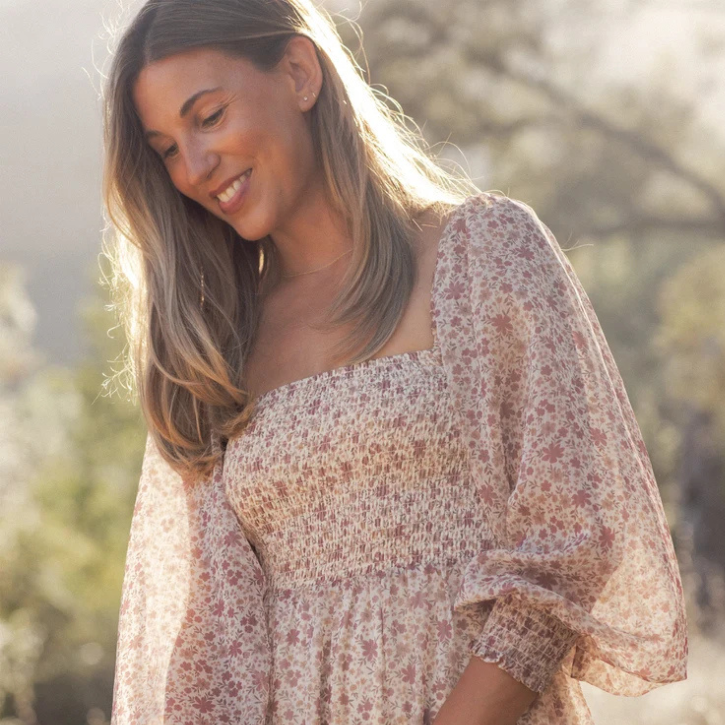 a neutral colored long sleeve maxi dress. 