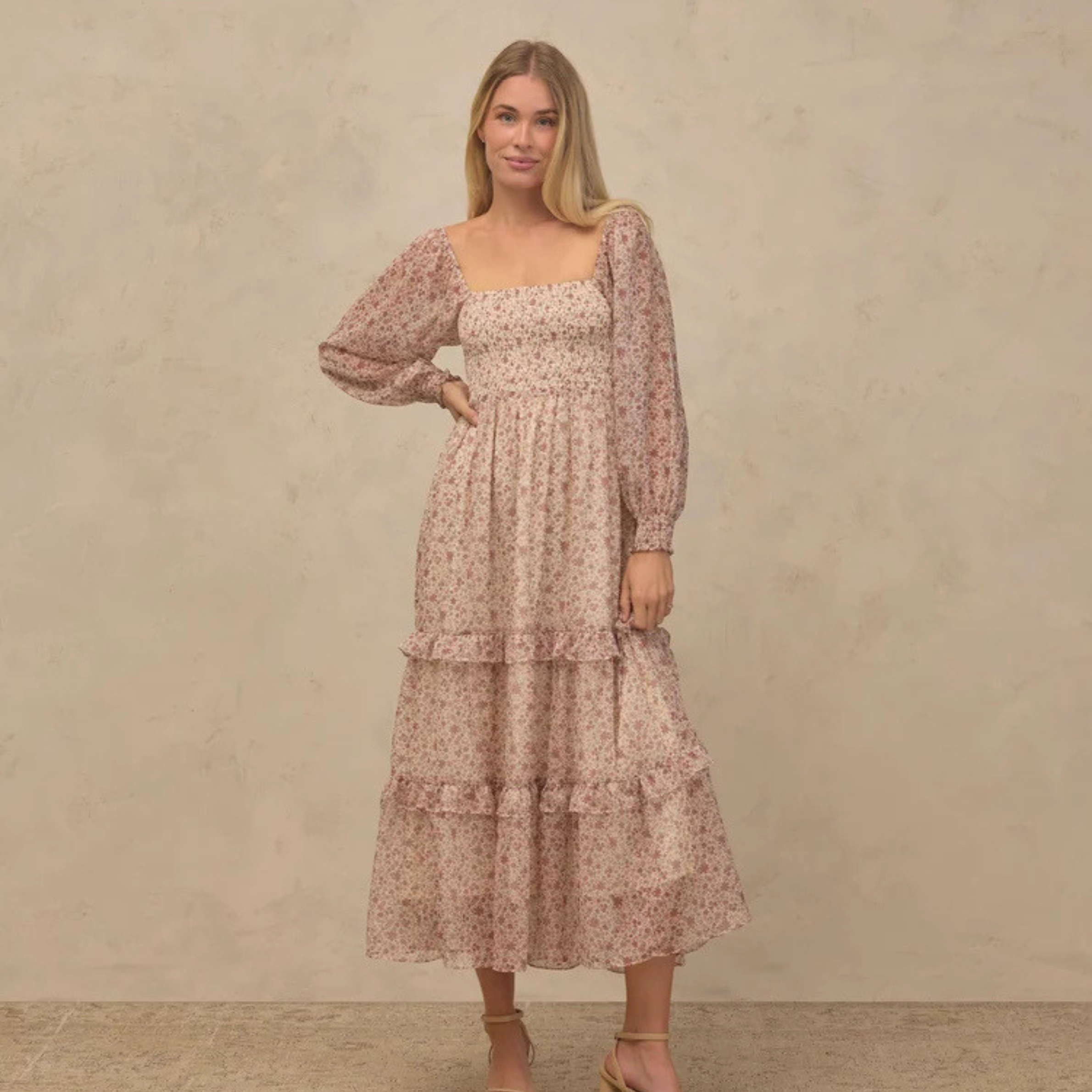 a neutral colored long sleeve maxi dress. 