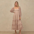 a neutral colored long sleeve maxi dress. 