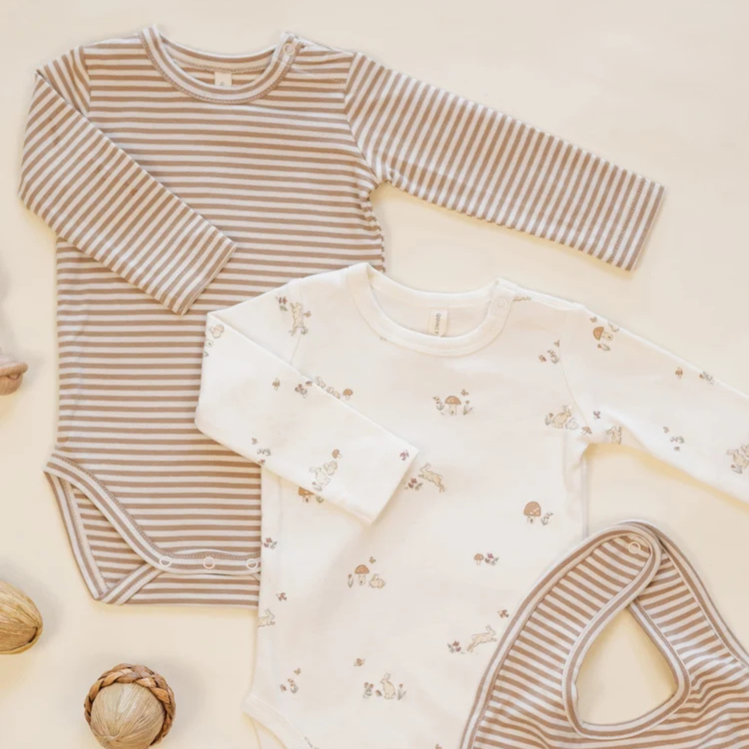 a set of long sleeve bodysuits for babies. 