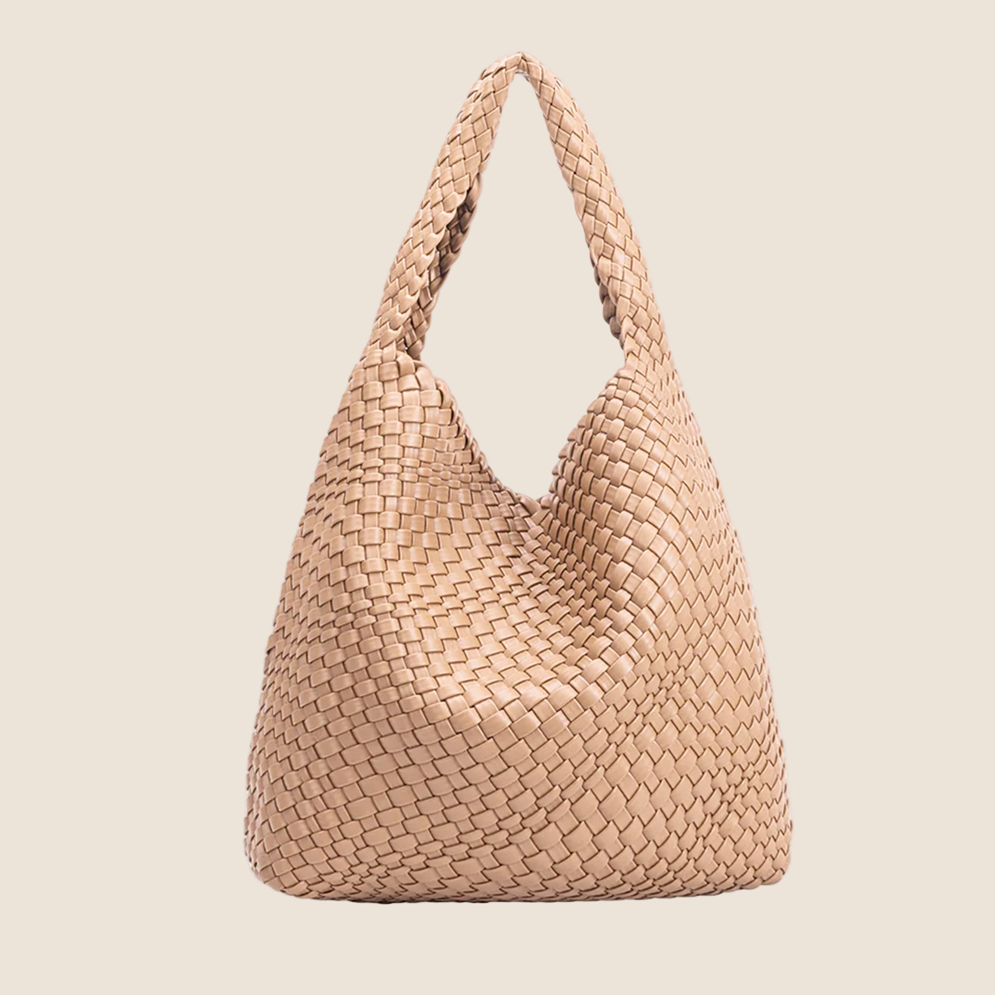 A nude woven handbag with a zipper pouch insert. 