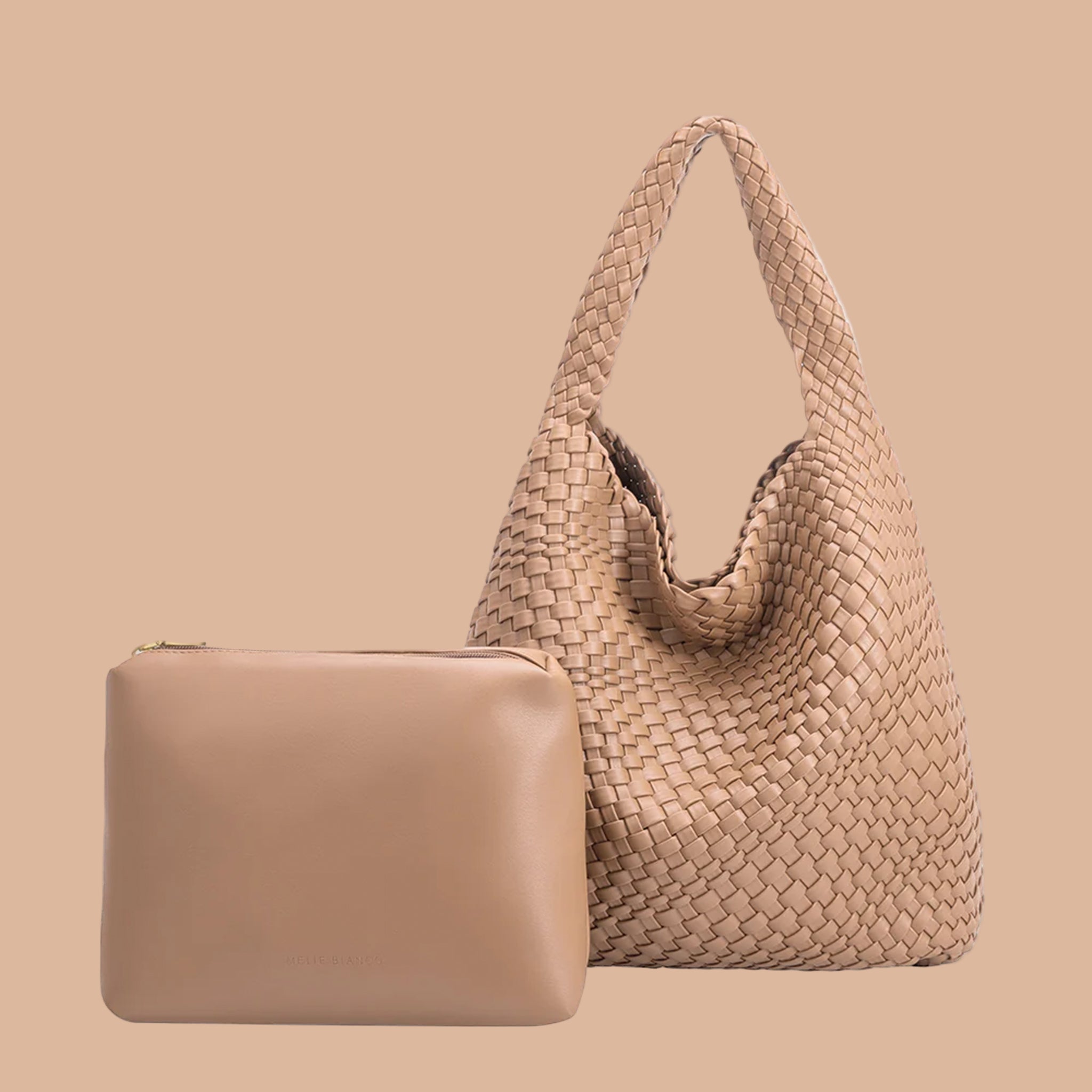 A nude woven handbag with a zipper pouch insert. 