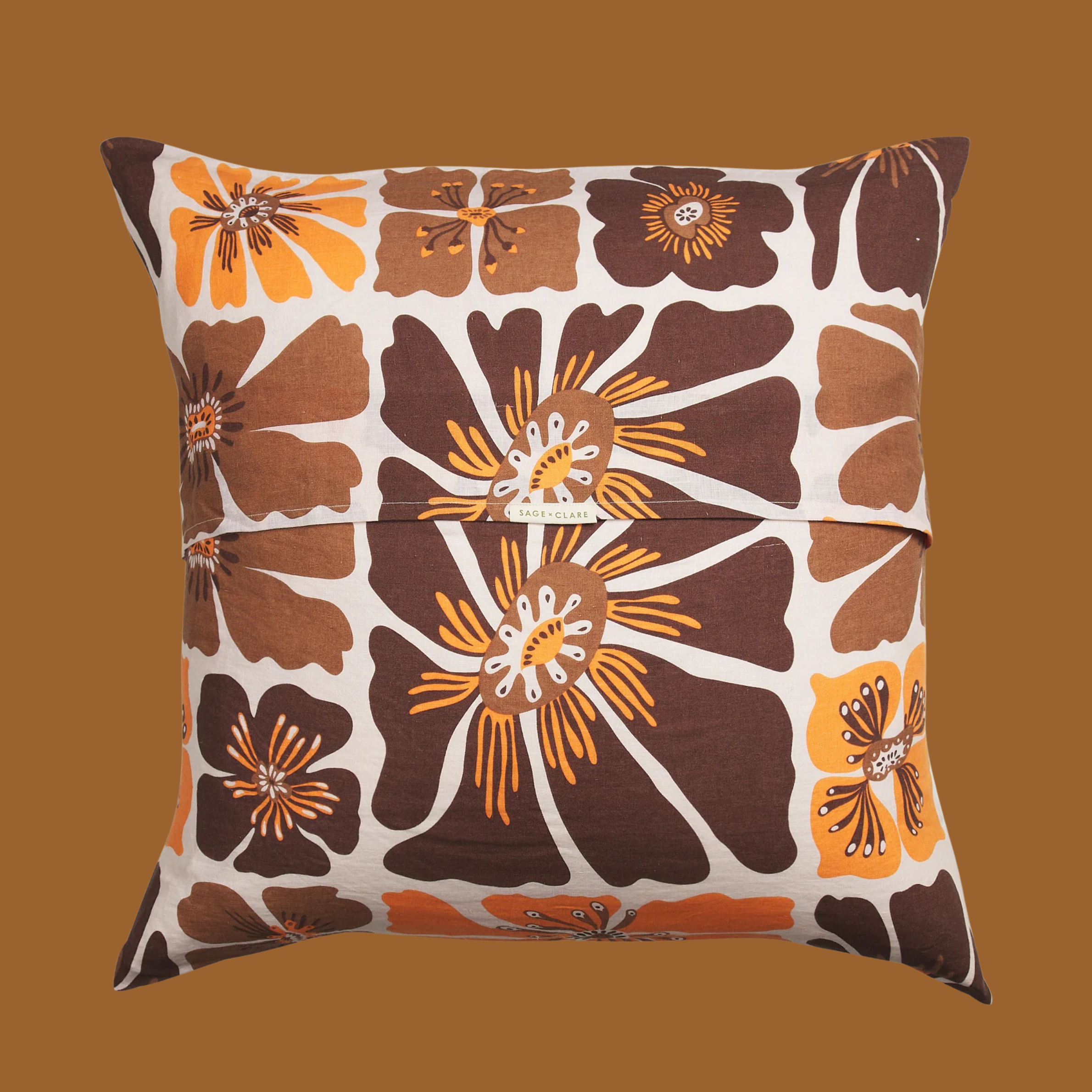 a brown and yellow floral print pillow. 