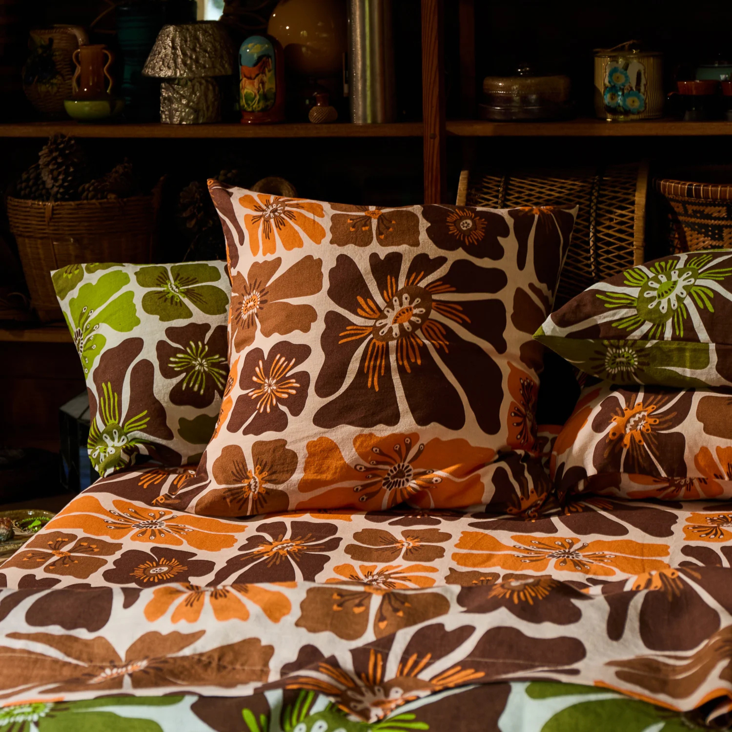 a brown and yellow floral print pillow. 
