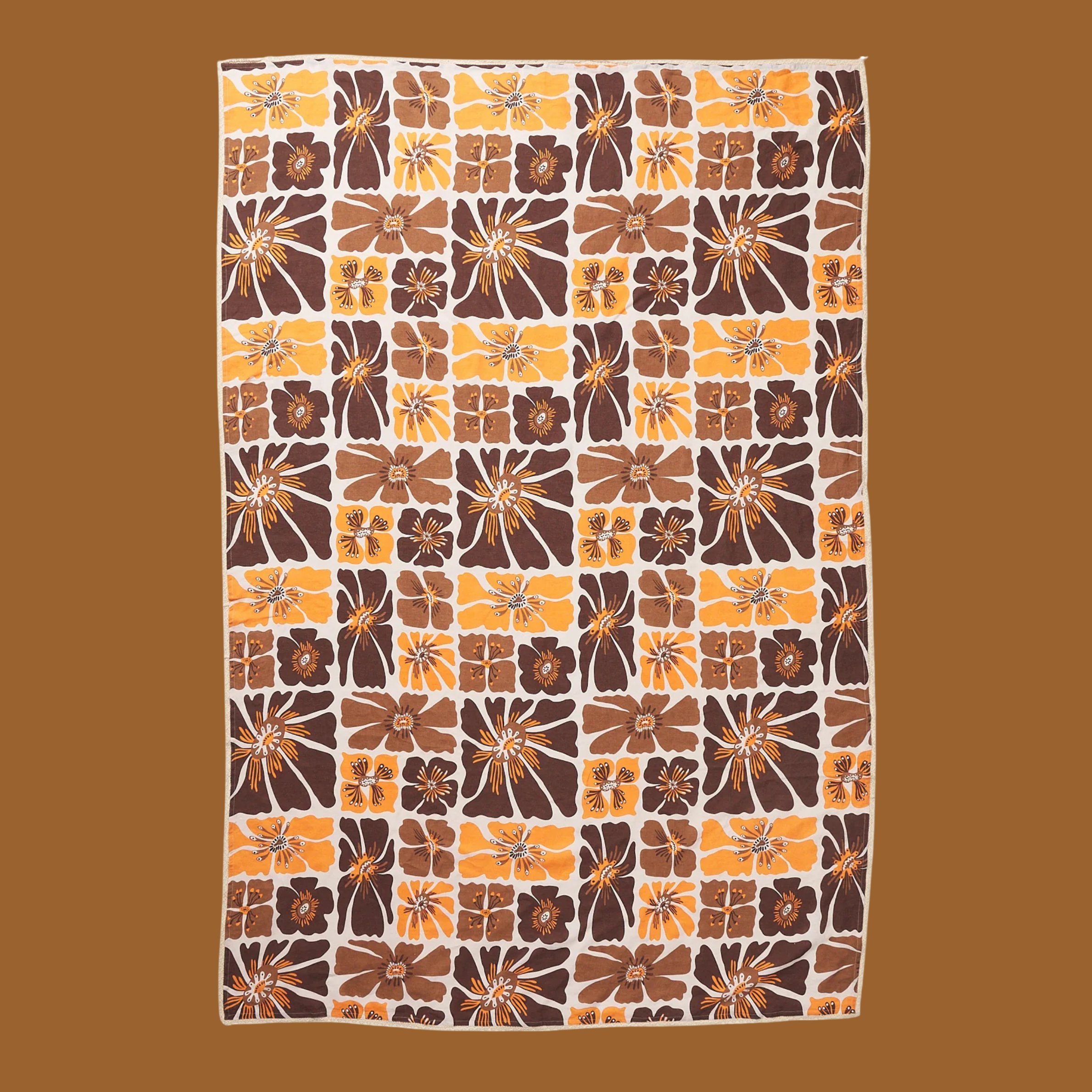 a brown and yellow floral print table cloth. 