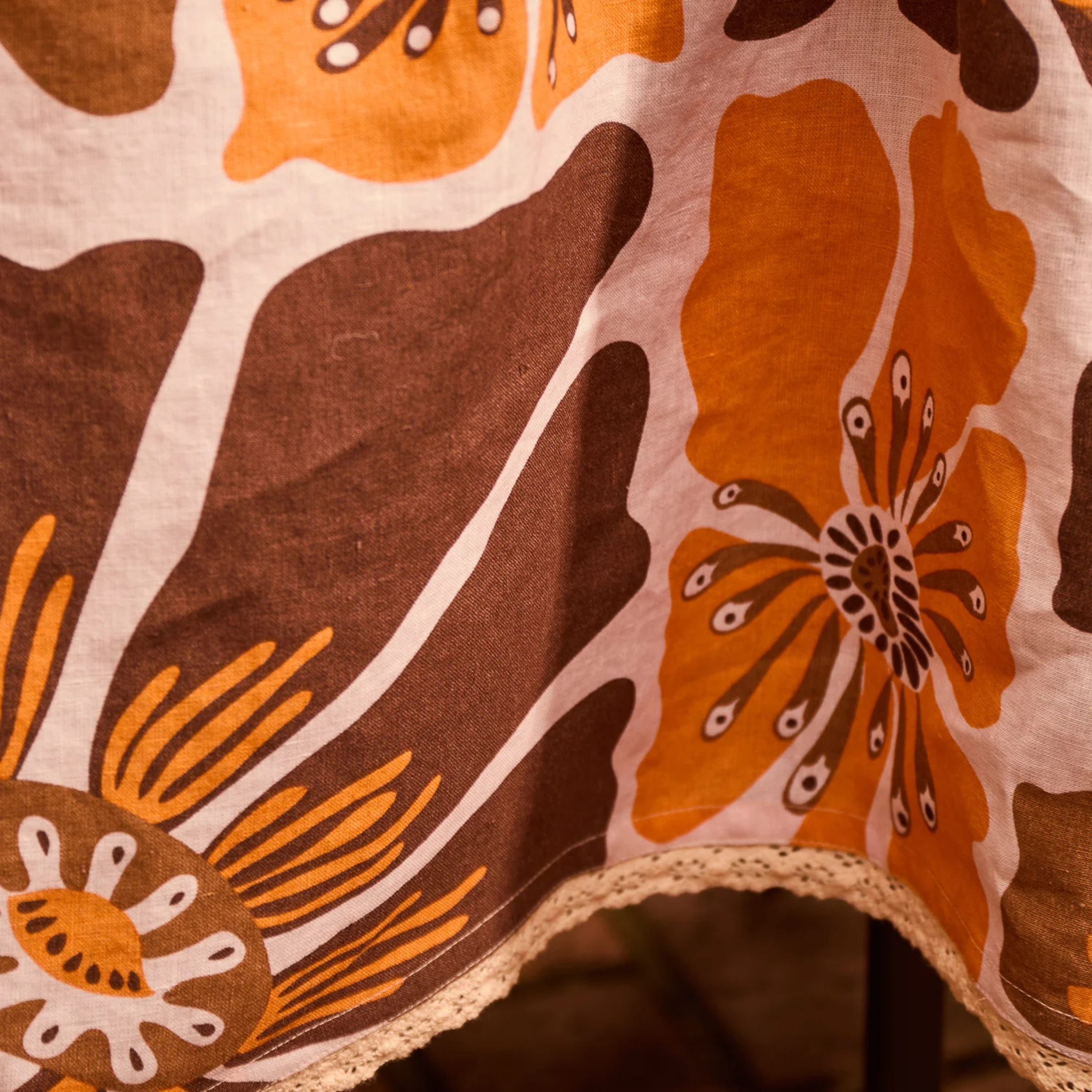 a brown and yellow floral print table cloth. 
