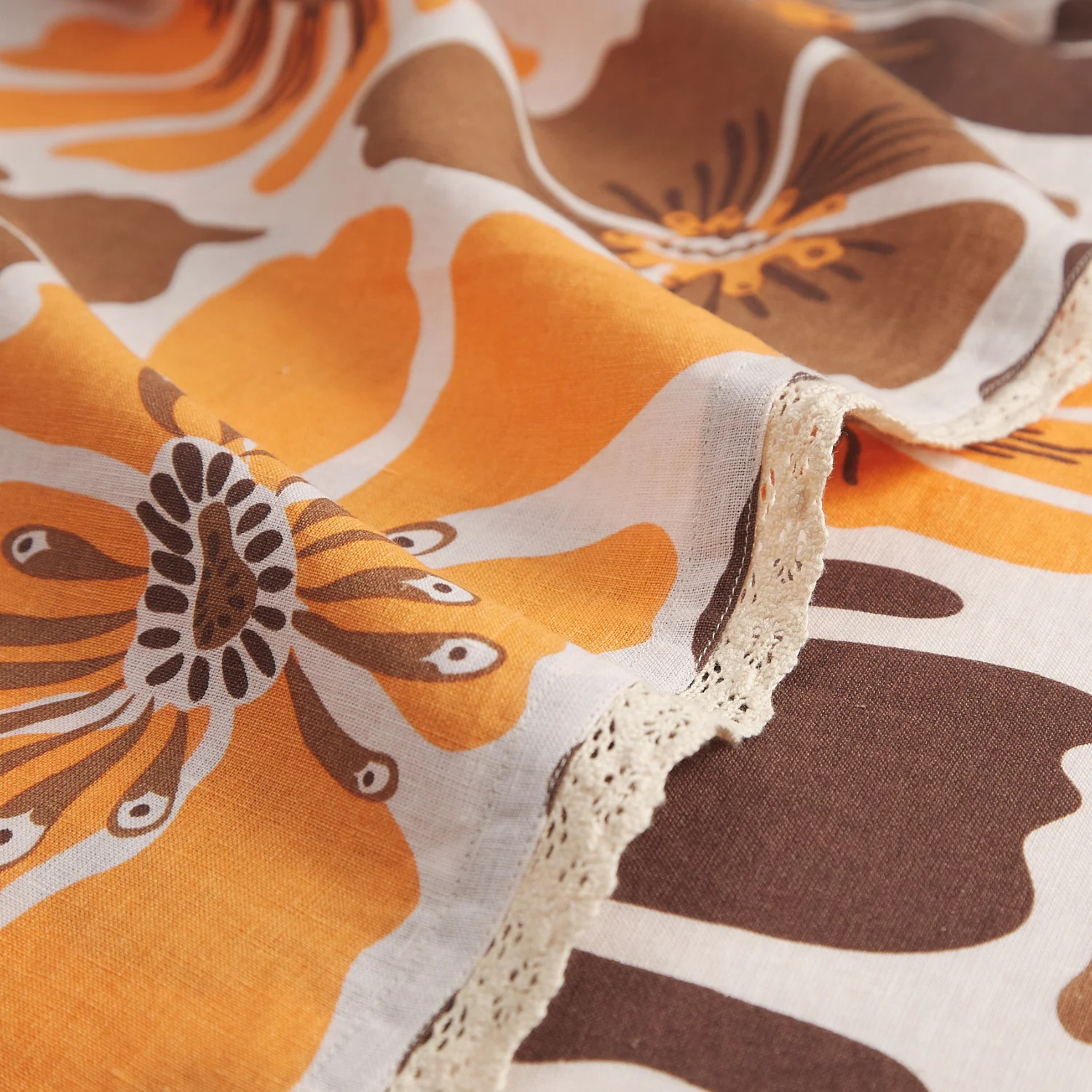 a brown and yellow floral print table cloth. 