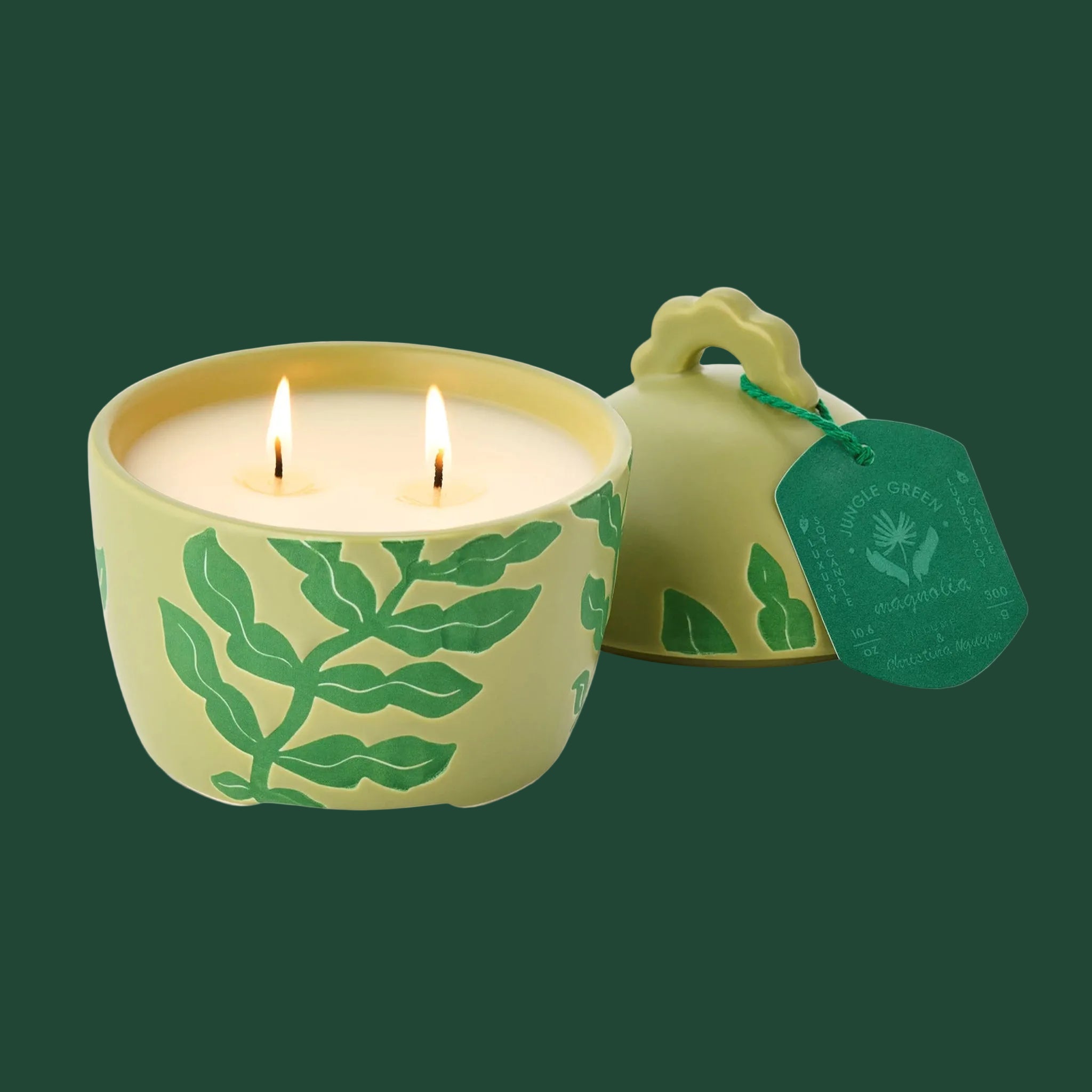 A green ceramic lidded jar candle