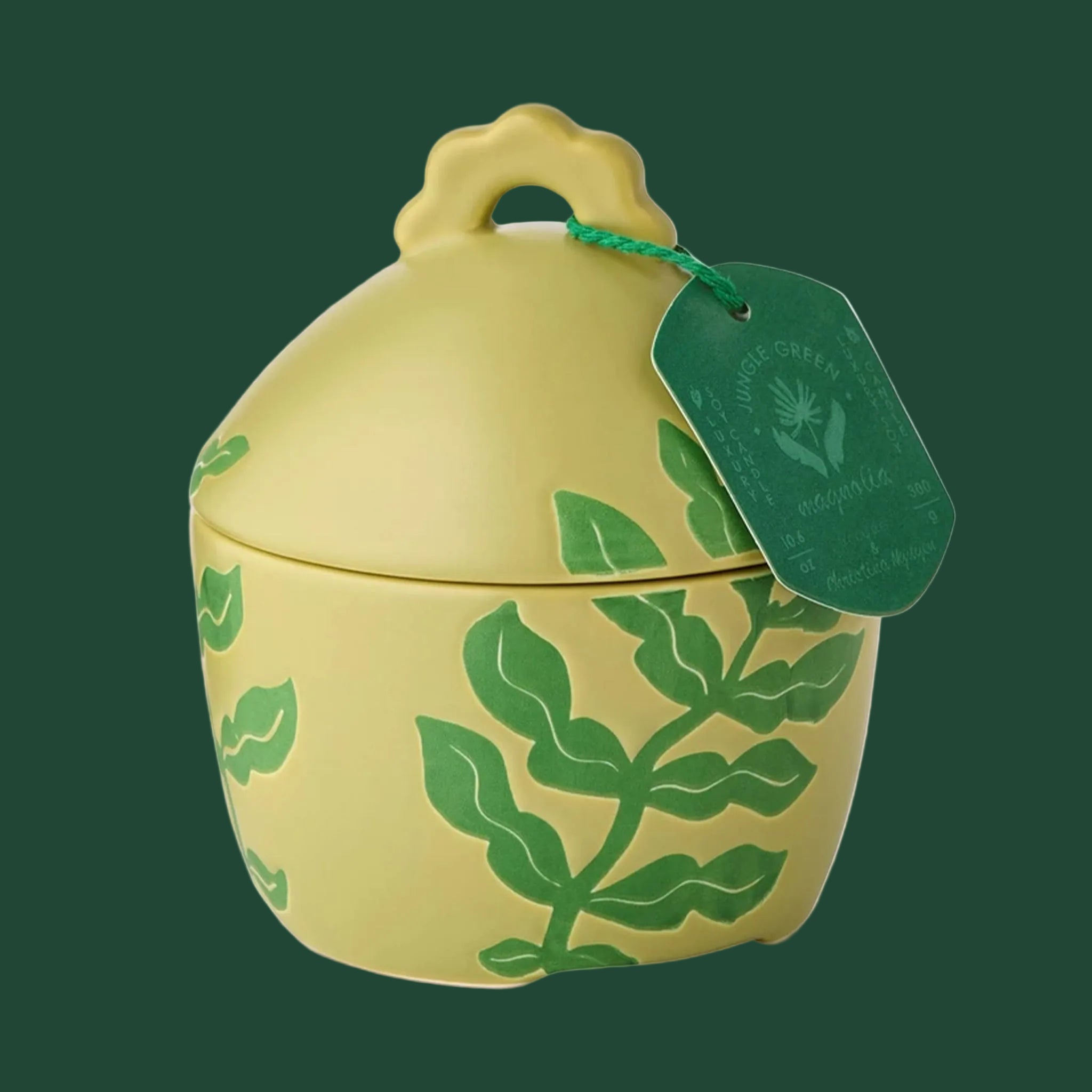 A green ceramic lidded jar candle. 