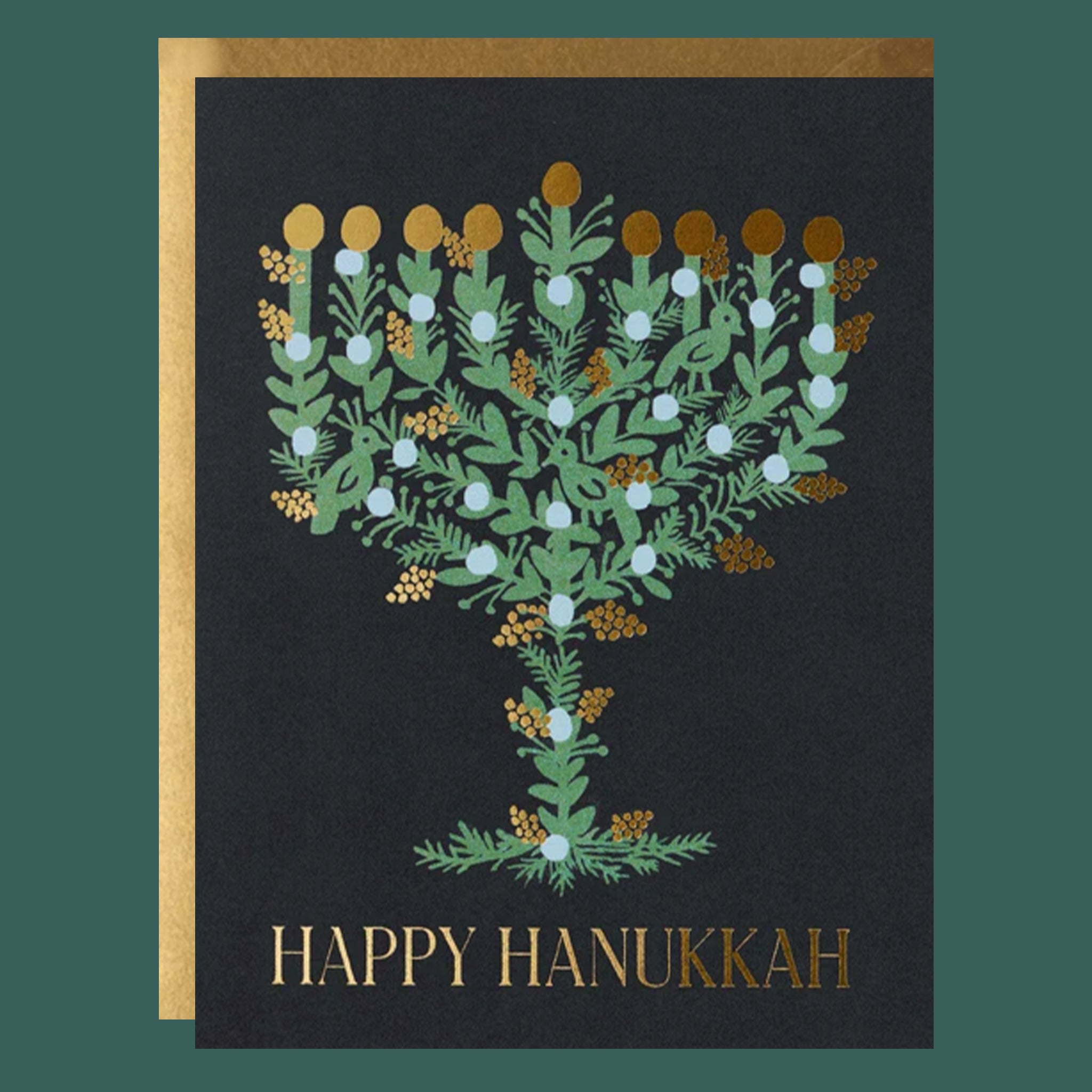 A black card with a leafy menorah shape and text that reads, 'Happy Hanukkah'. 