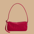 a red shoulder handbag. 