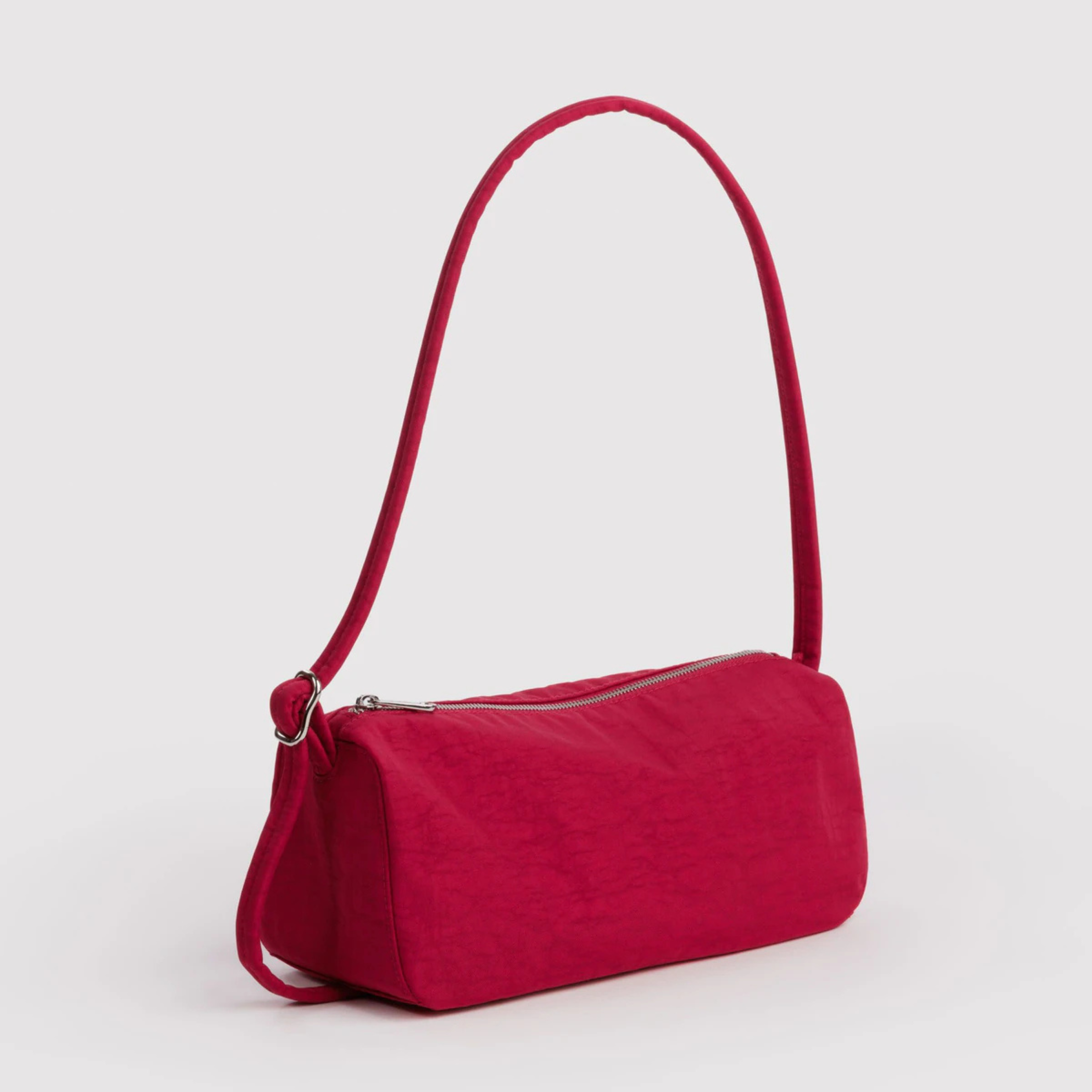 a red shoulder handbag. 