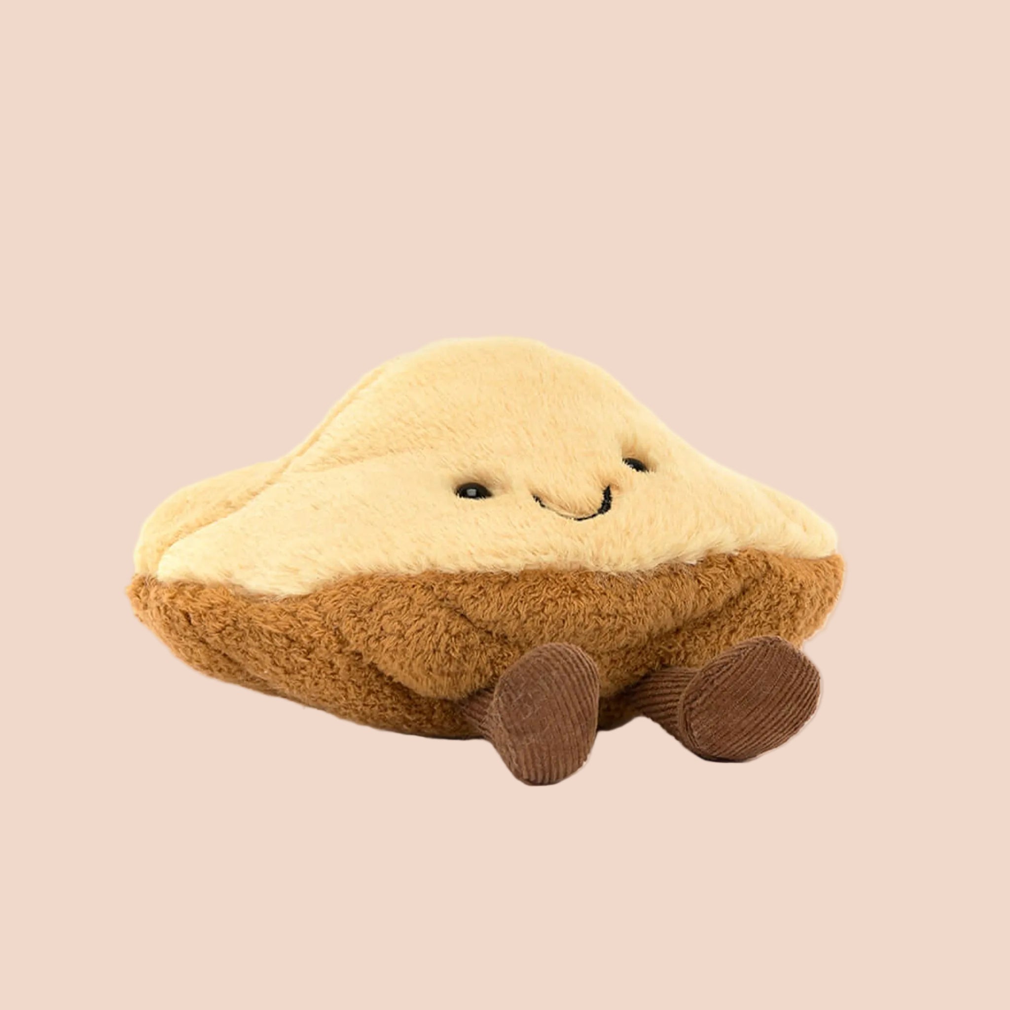 A madeleine shaped stuffed toy. 